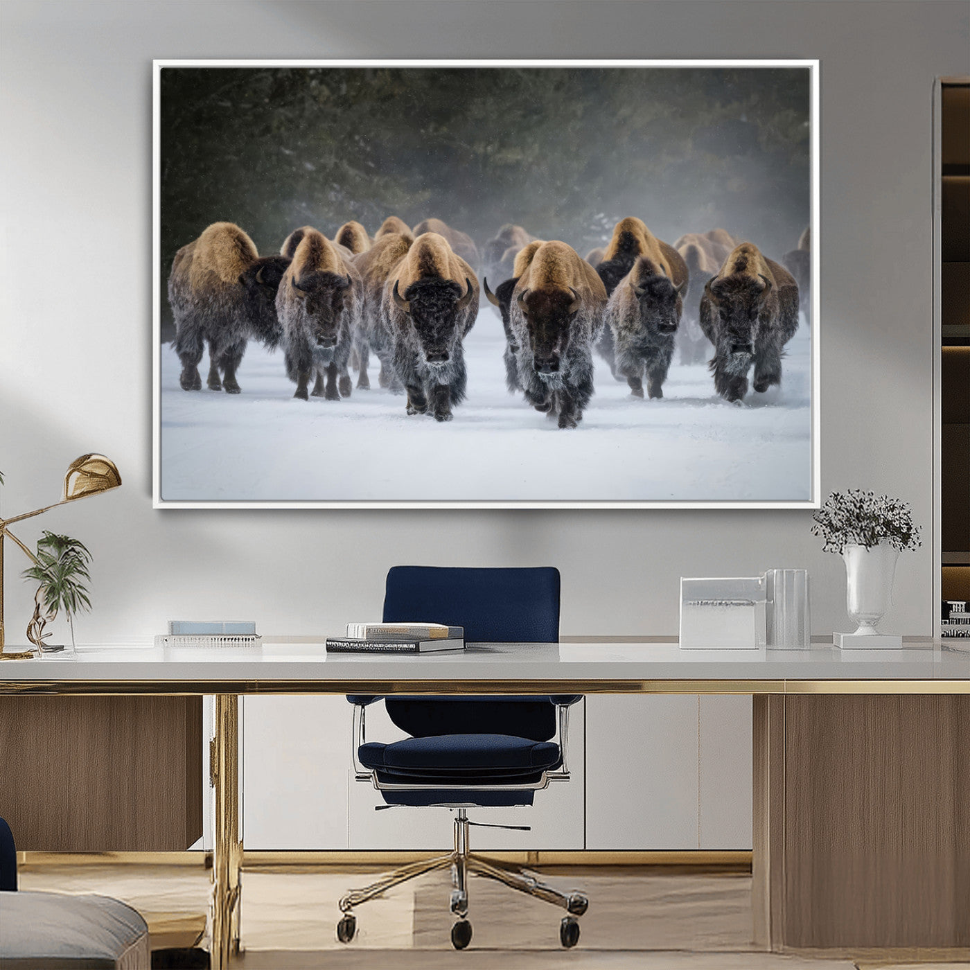 A herd of American bisons walking through deep snow in a forest, evoking a powerful rustic wilderness mood for western-style interiors.
