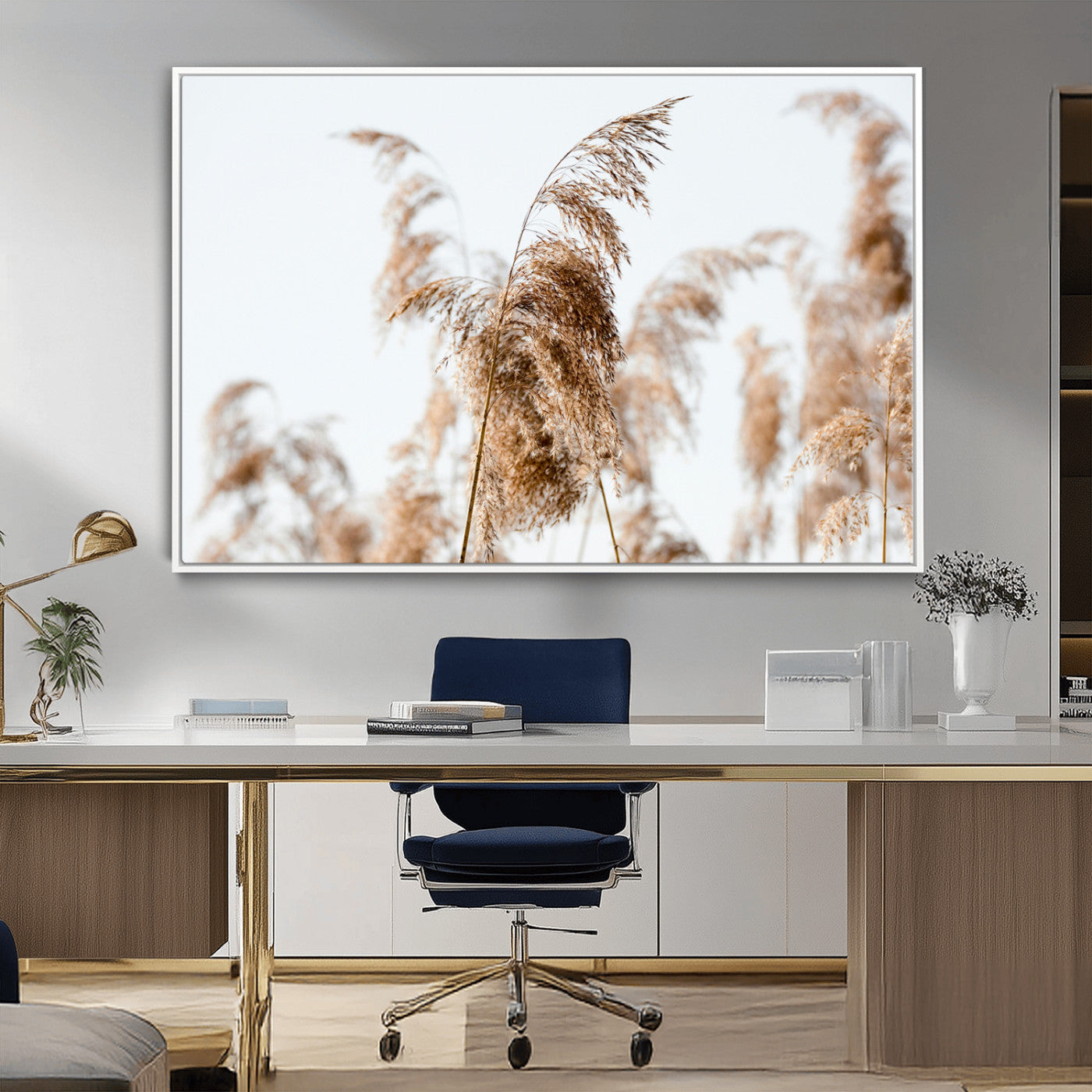Close-up of pampas grass swaying in the wind against a soft white sky, creating a neutral and minimalist botanical aesthetic.