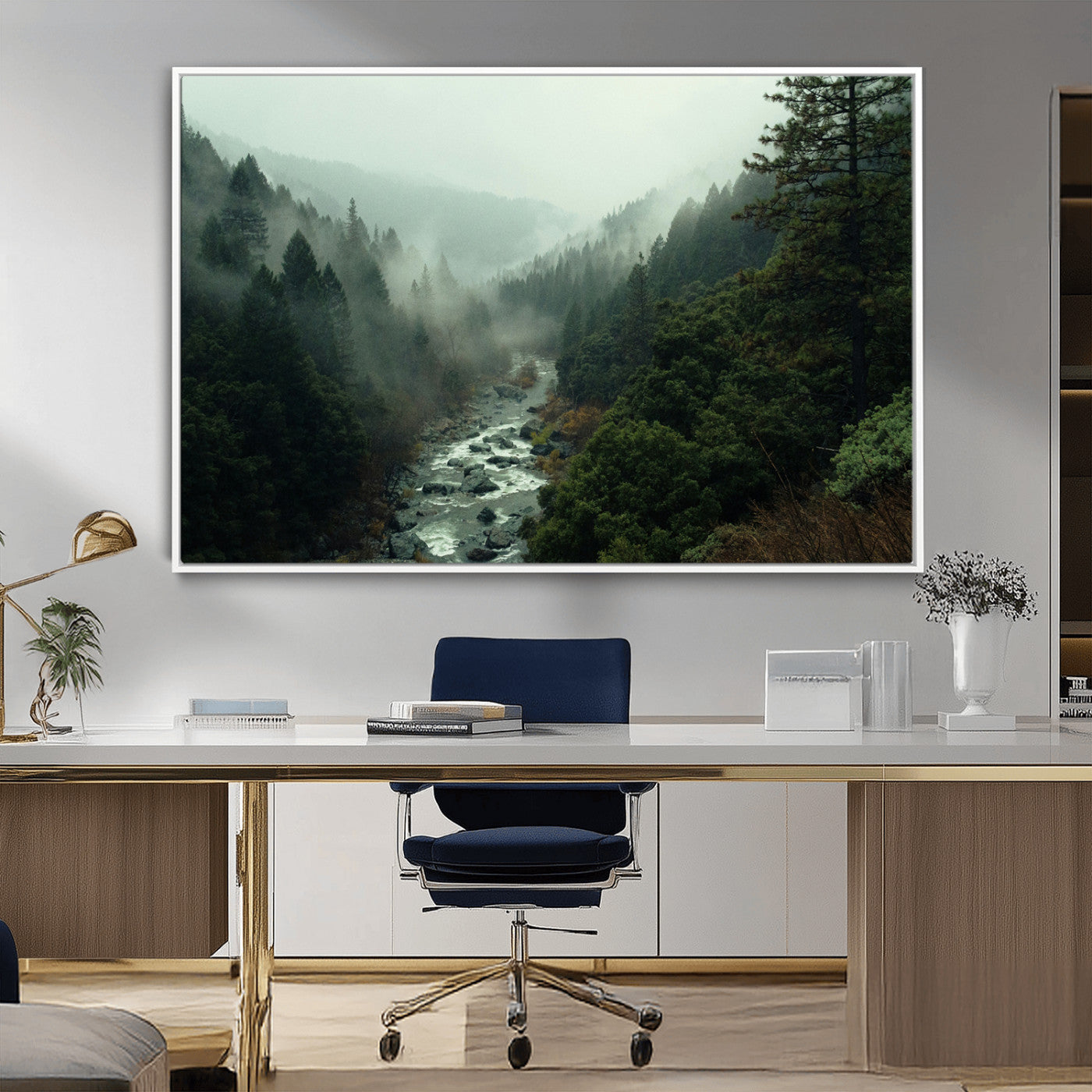 Misty forest with a winding river flowing through lush green mountains, creating a tranquil and moody wilderness landscape.