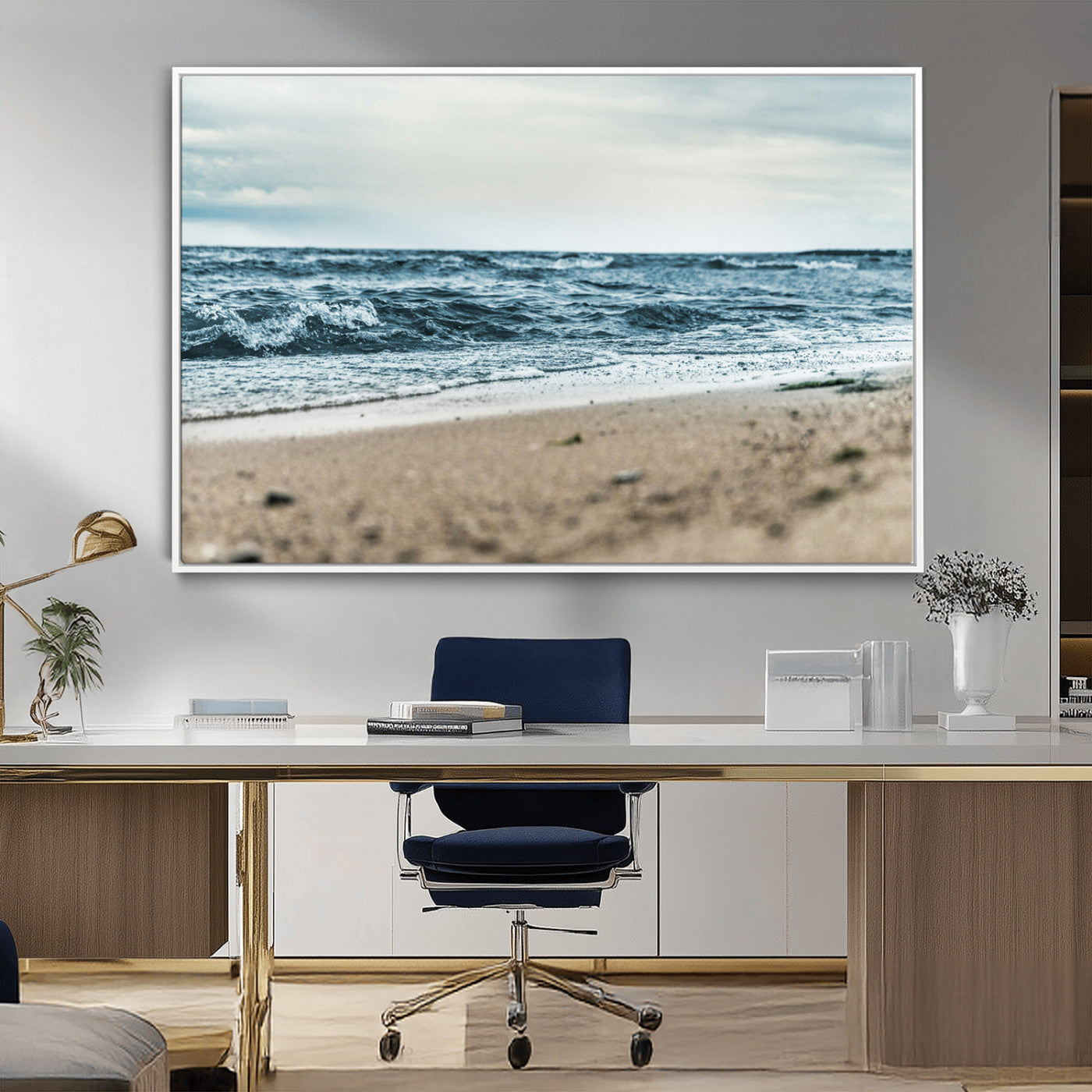 A moody ocean scene with gentle waves washing onto a sandy beach under a cloudy sky, creating a peaceful and coastal atmosphere.