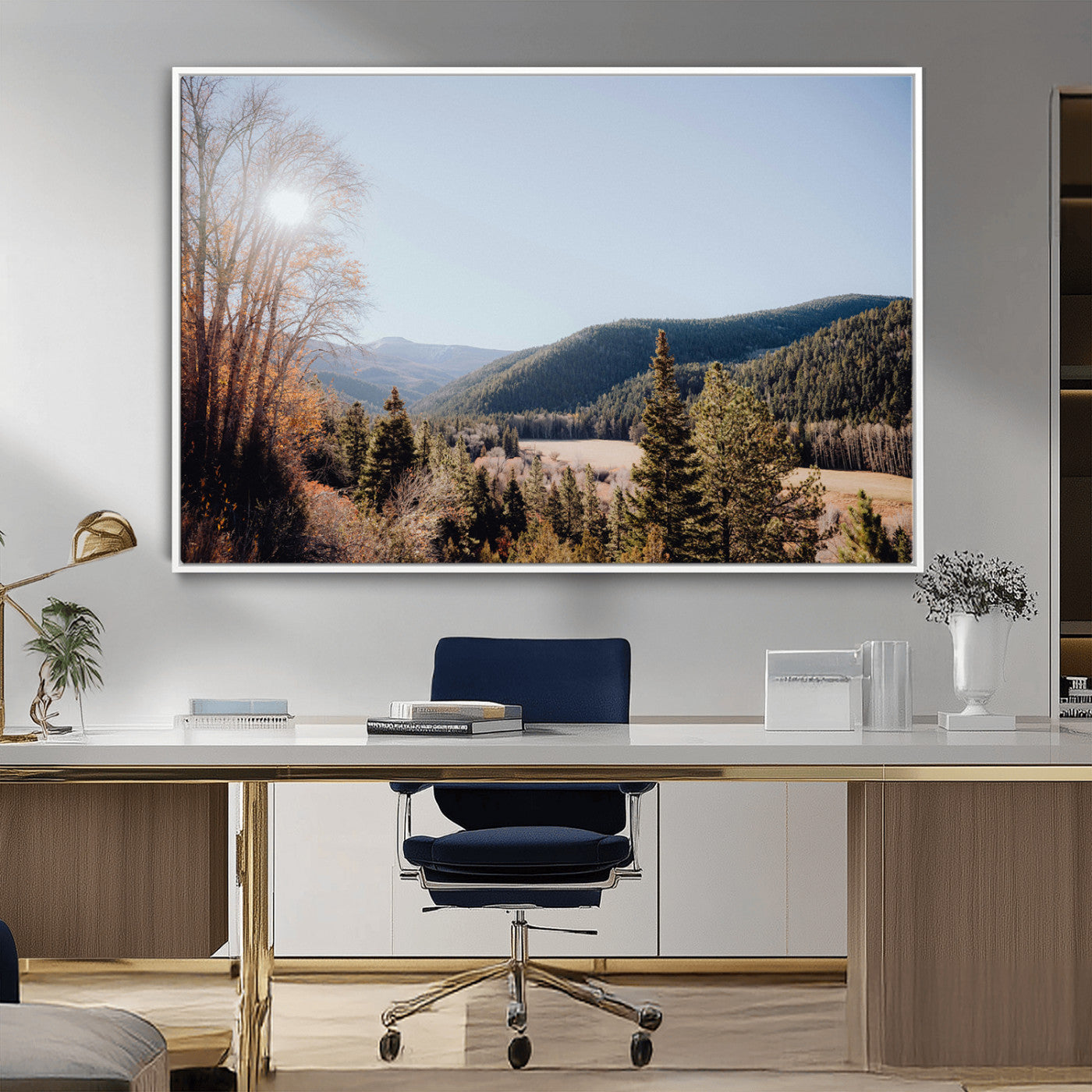A scenic mountain valley with pine trees and autumn foliage under a clear sky, bathed in golden sunlight, creating a peaceful and rustic landscape.