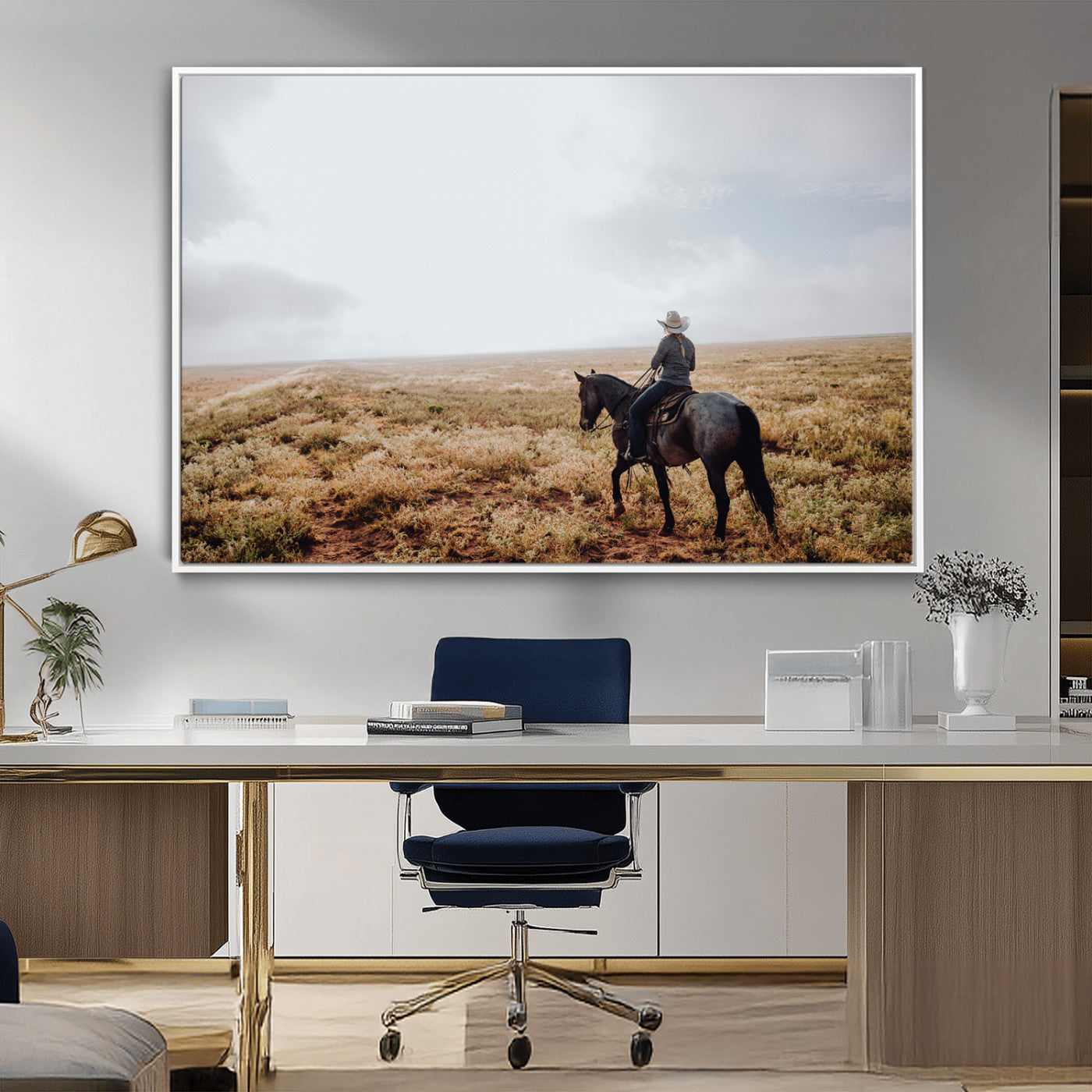 A lone cowboy riding horseback across an open prairie under a vast sky, capturing the rugged and timeless spirit of the Western frontier.