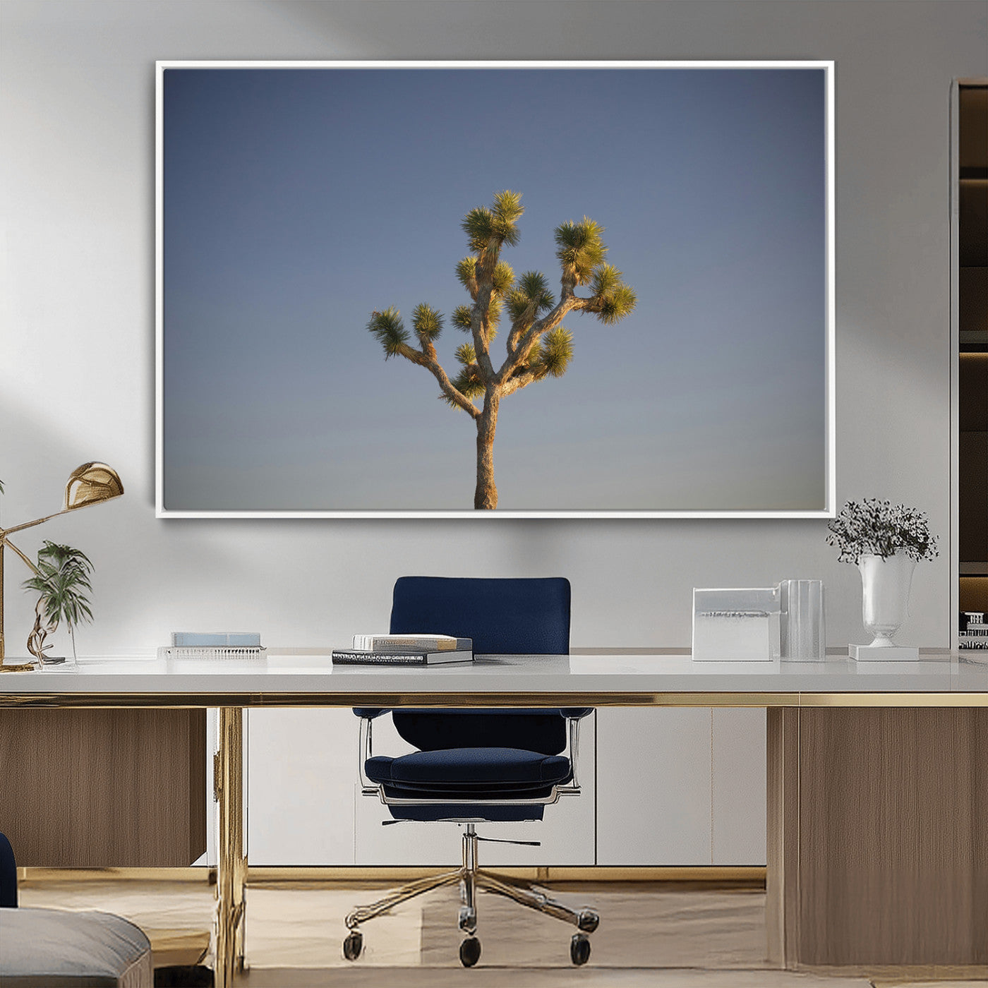 A lone Joshua Tree standing against a deep blue sky, capturing the serene and rugged beauty of the Southwestern desert landscape.