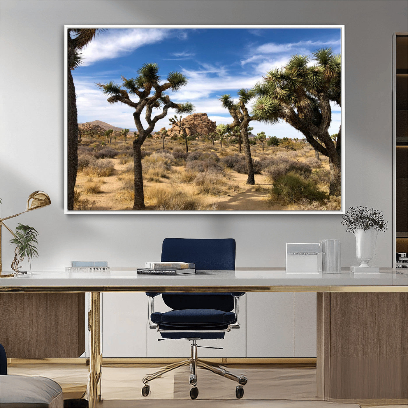 Scenic Joshua Tree landscape with rugged desert terrain, golden dry grass, and a deep blue sky, creating a warm, rustic Southwestern aesthetic.