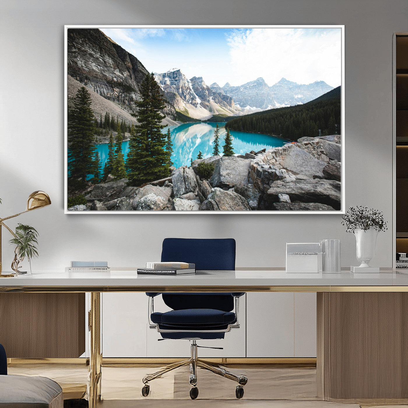 Stunning view of Moraine Lake with turquoise waters reflecting snow-capped mountains and evergreen trees, creating a peaceful alpine decor.