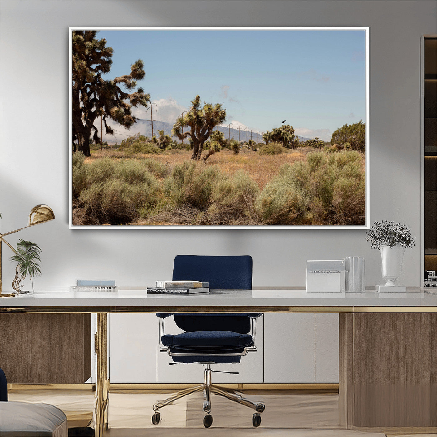 Scenic desert landscape with Joshua trees, dry grass, and distant mountains under a clear blue sky, perfect for southwestern and rustic decor.