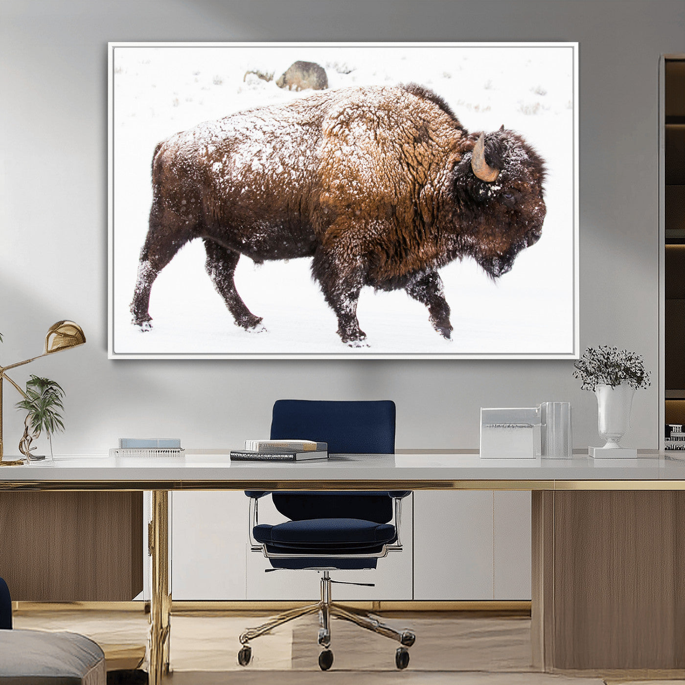 Side profile of a powerful bison walking through deep snow, with frost-covered fur and a white winter background, perfect for rustic and western decor.