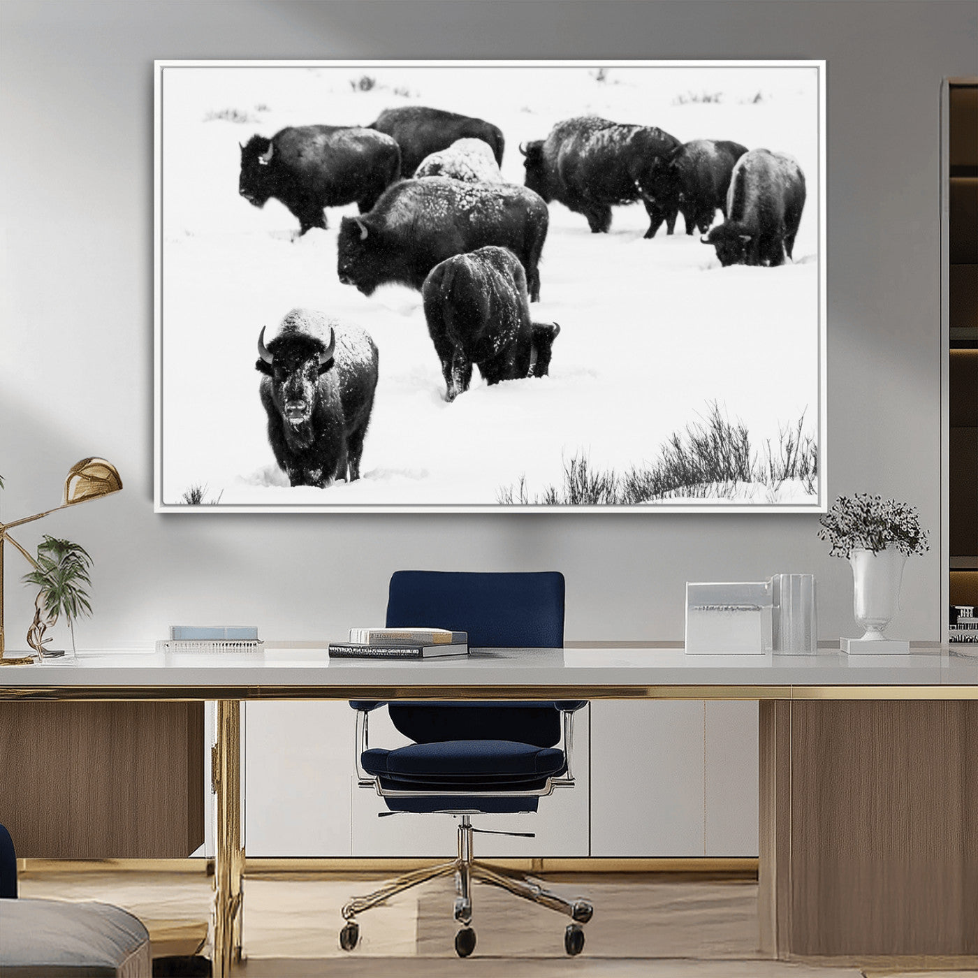Black and white photograph of a bison herd in a snowy landscape, with snow-covered fur and a rugged wilderness setting, perfect for rustic lodge decor.