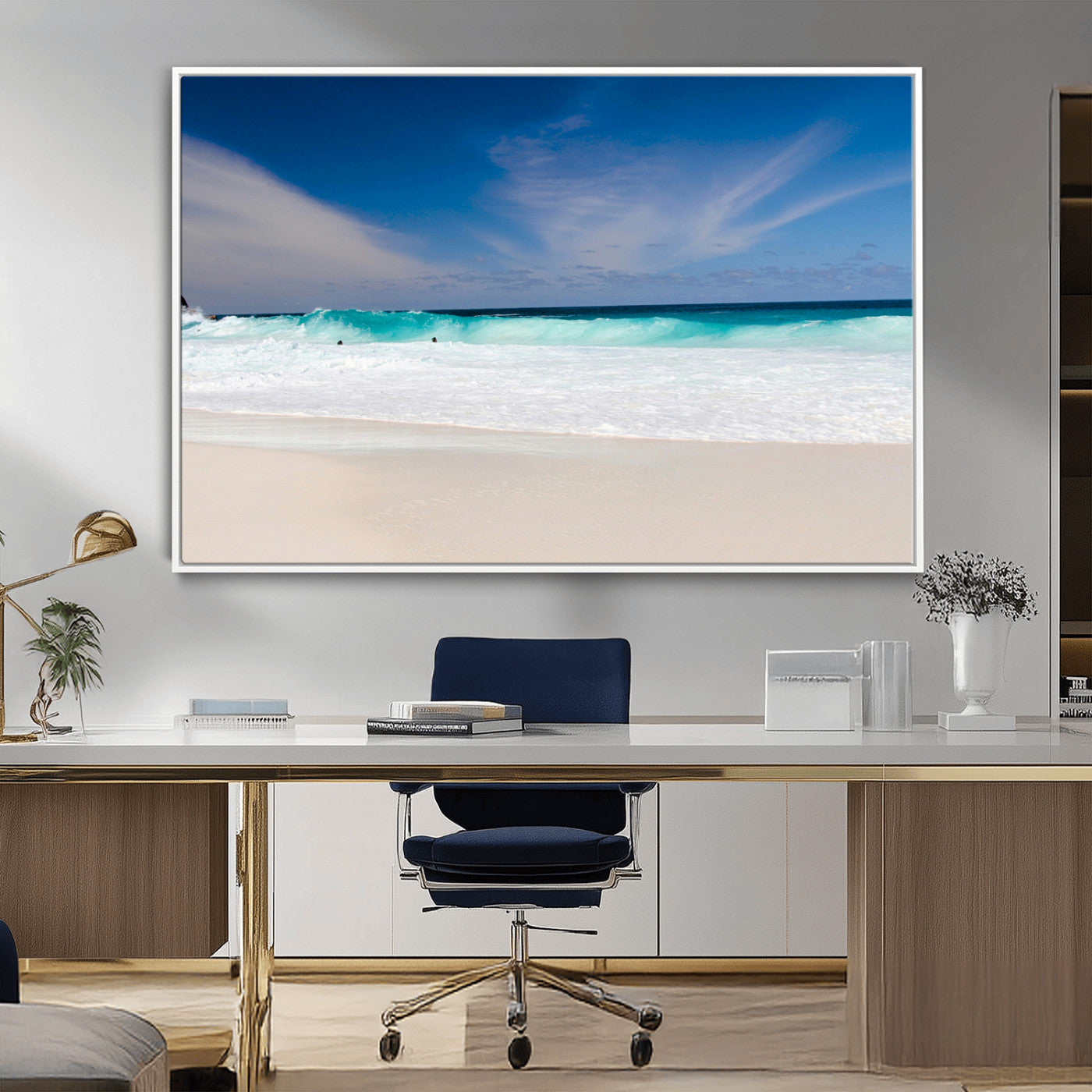 Turquoise waves crash onto a pristine white sand beach under a vivid blue sky with wispy clouds, creating a peaceful and refreshing coastal scene.