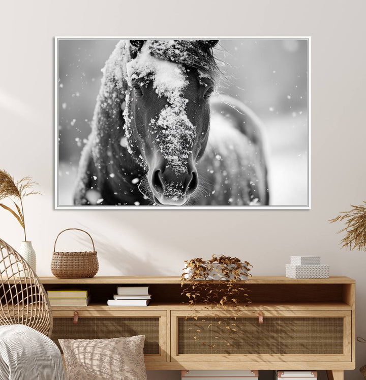 The Black and White Horse Winter Wall Art features a majestic horse with snow-covered hair set against a serene winter backdrop.