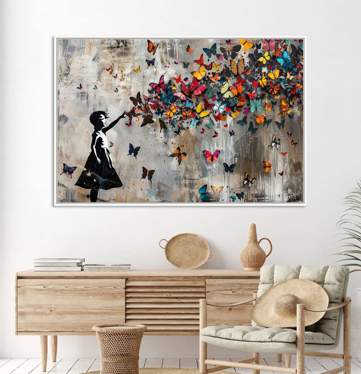 The Banksy Butterfly Girl 3-Piece Modern Graffiti Canvas Wall Art features a silhouette of a girl reaching for butterflies.