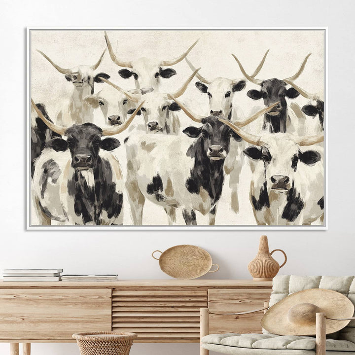 Canvas print titled Longhorn Texas Cow Drawing, depicting longhorn cattle with black and white markings, made in the USA, displayed on the wall.