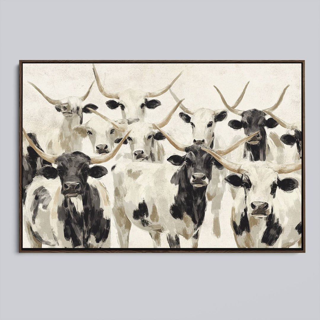 Canvas print titled Longhorn Texas Cow Drawing, depicting longhorn cattle with black and white markings, made in the USA, displayed on the wall.