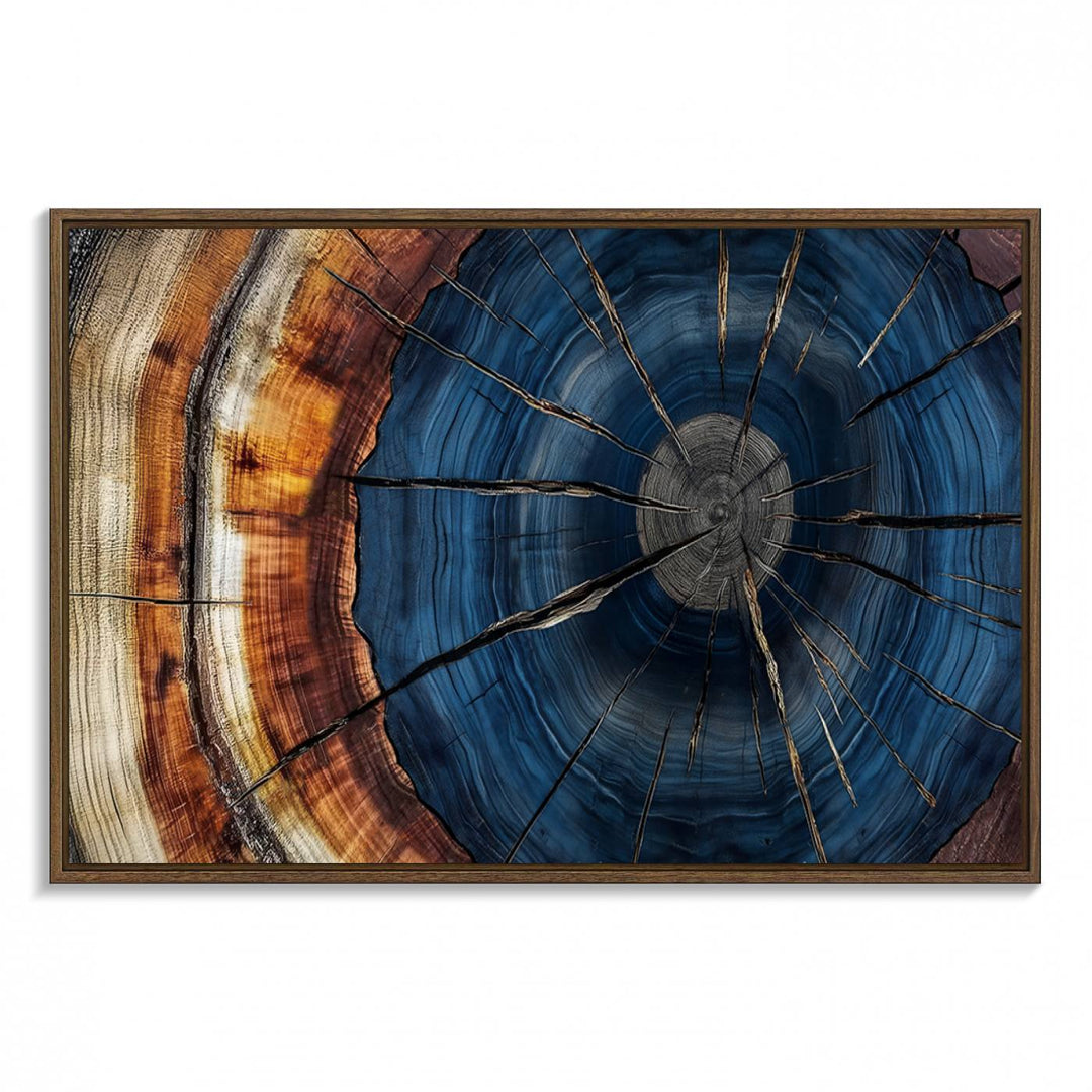 The Abstract Tree Rings Canvas Print features blue, brown, and orange rings that highlight wood grain and natures beauty.