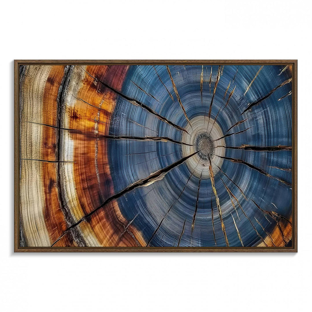 Close-up of blue, brown, and orange wood grain rings on the Abstract Tree Rings Canvas Wall Art Print.