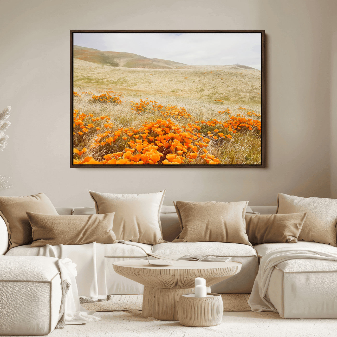 A golden field with vibrant orange poppies blooming across rolling hills under a soft, sunlit sky, creating a warm and rustic landscape.