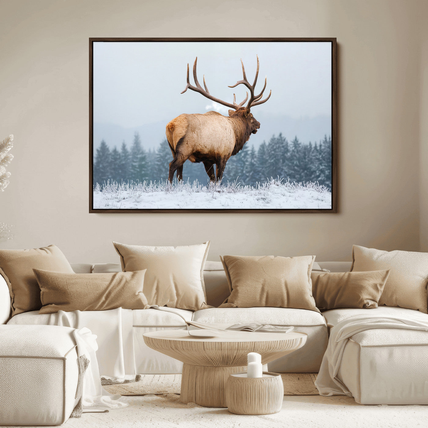 Large elk standing in a snowy field with pine trees in the background, ideal for rustic cabin or lodge-style wall decor.