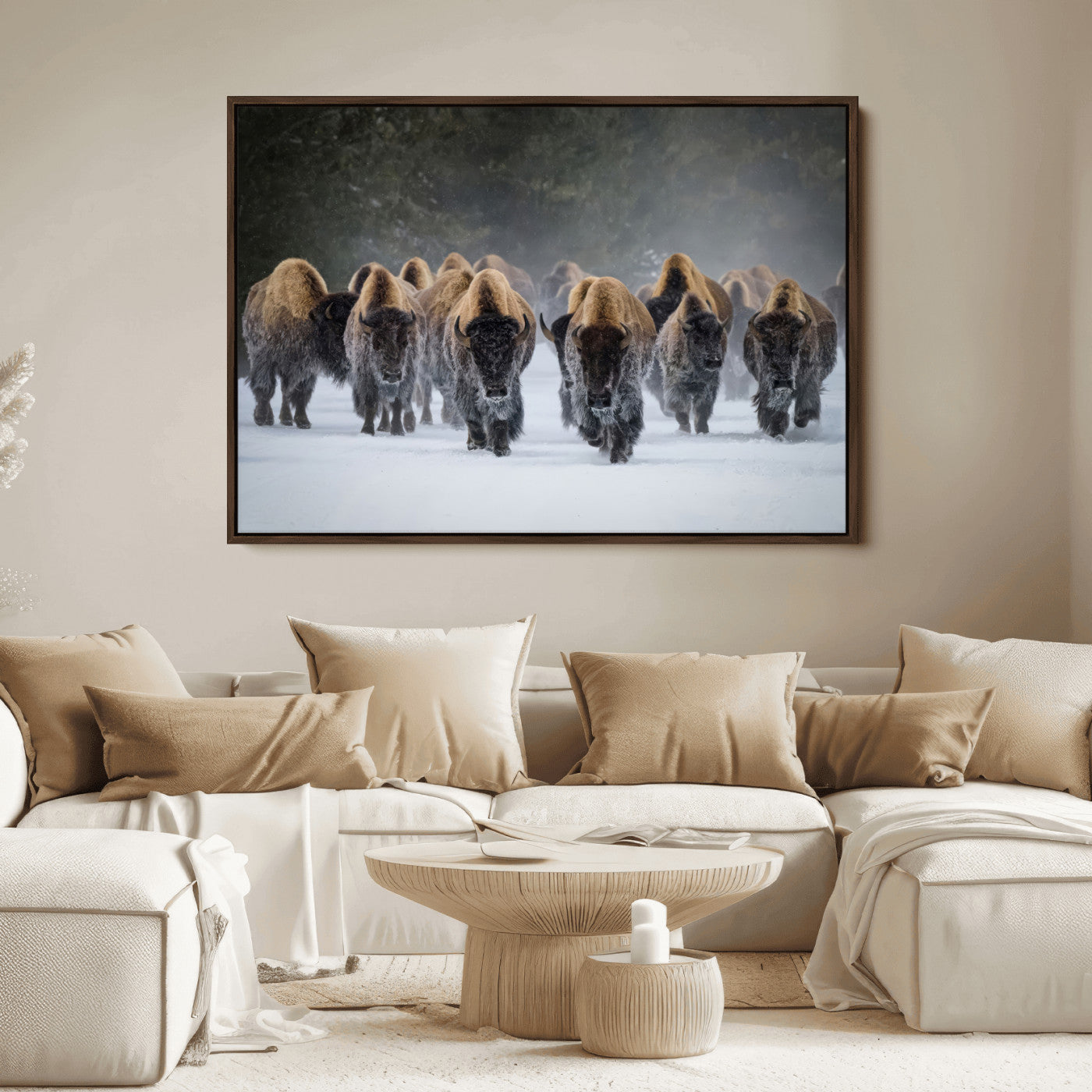 A herd of American bisons walking through deep snow in a forest, evoking a powerful rustic wilderness mood for western-style interiors.