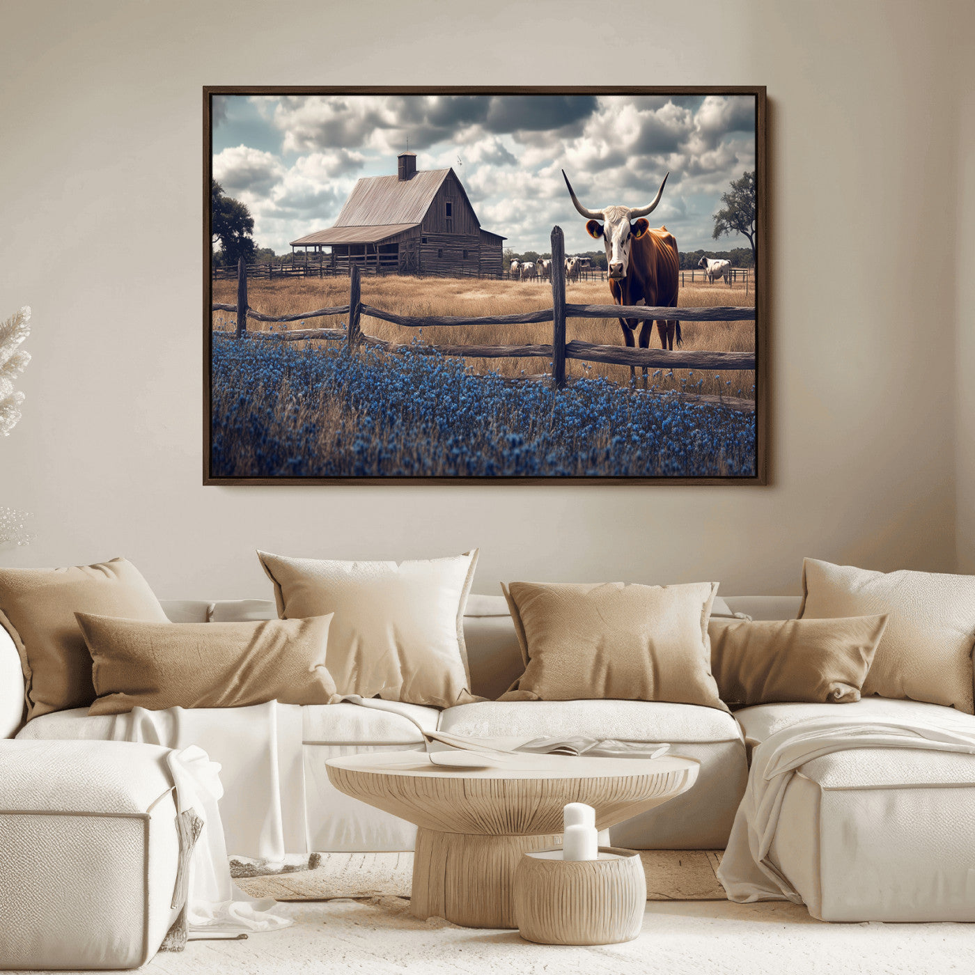 Framed canvas art of a Texas Longhorn cow near a rustic barn and bluebonnet field, ideal for country-style or farmhouse wall decor.