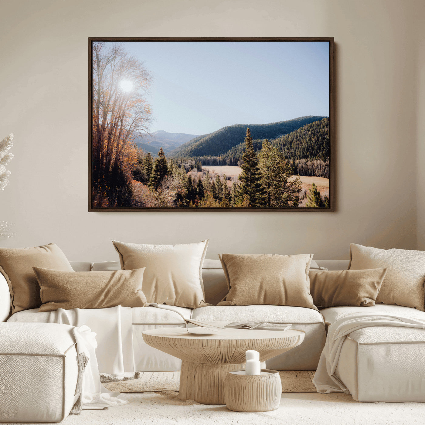 A scenic mountain valley with pine trees and autumn foliage under a clear sky, bathed in golden sunlight, creating a peaceful and rustic landscape.