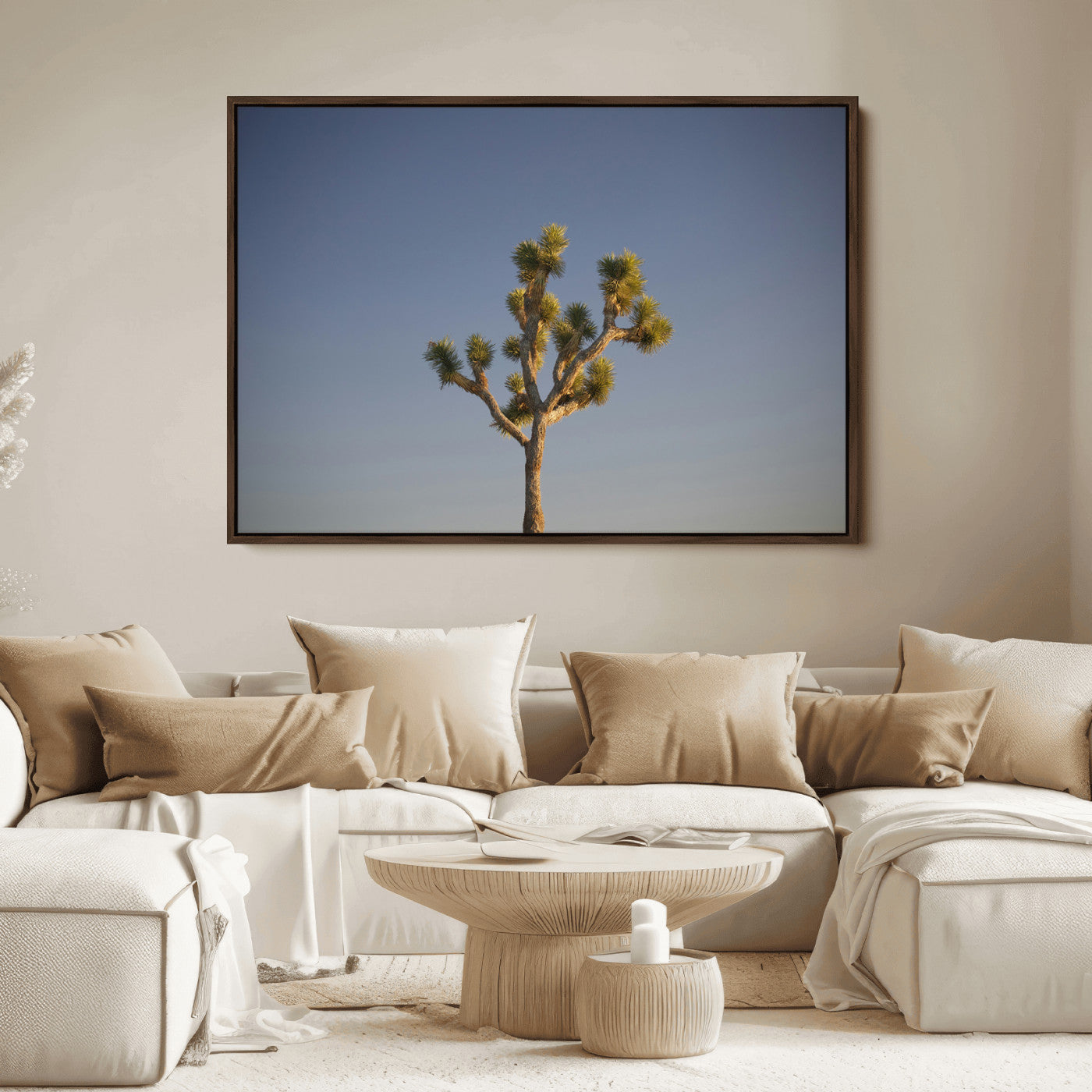 A lone Joshua Tree standing against a deep blue sky, capturing the serene and rugged beauty of the Southwestern desert landscape.