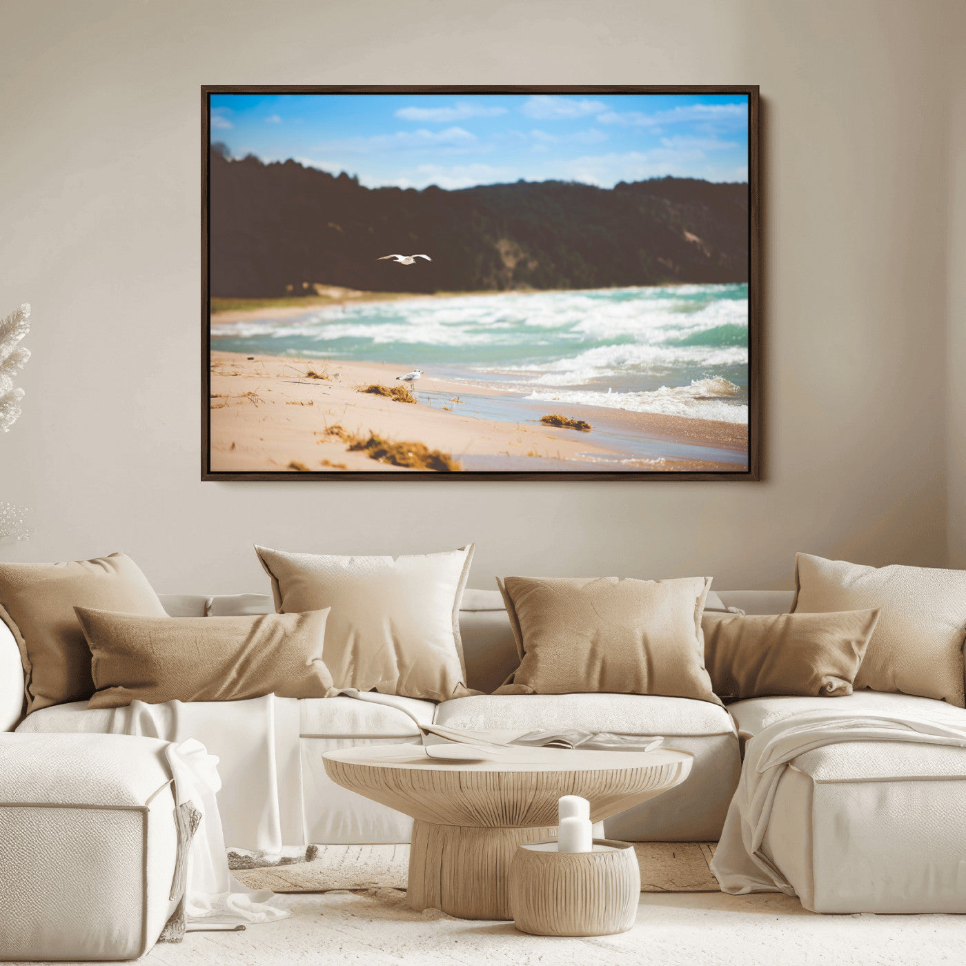 Serene beach scene with gentle ocean waves, sandy shore, and a seagull flying under a blue sky, perfect for coastal and nature-inspired decor.