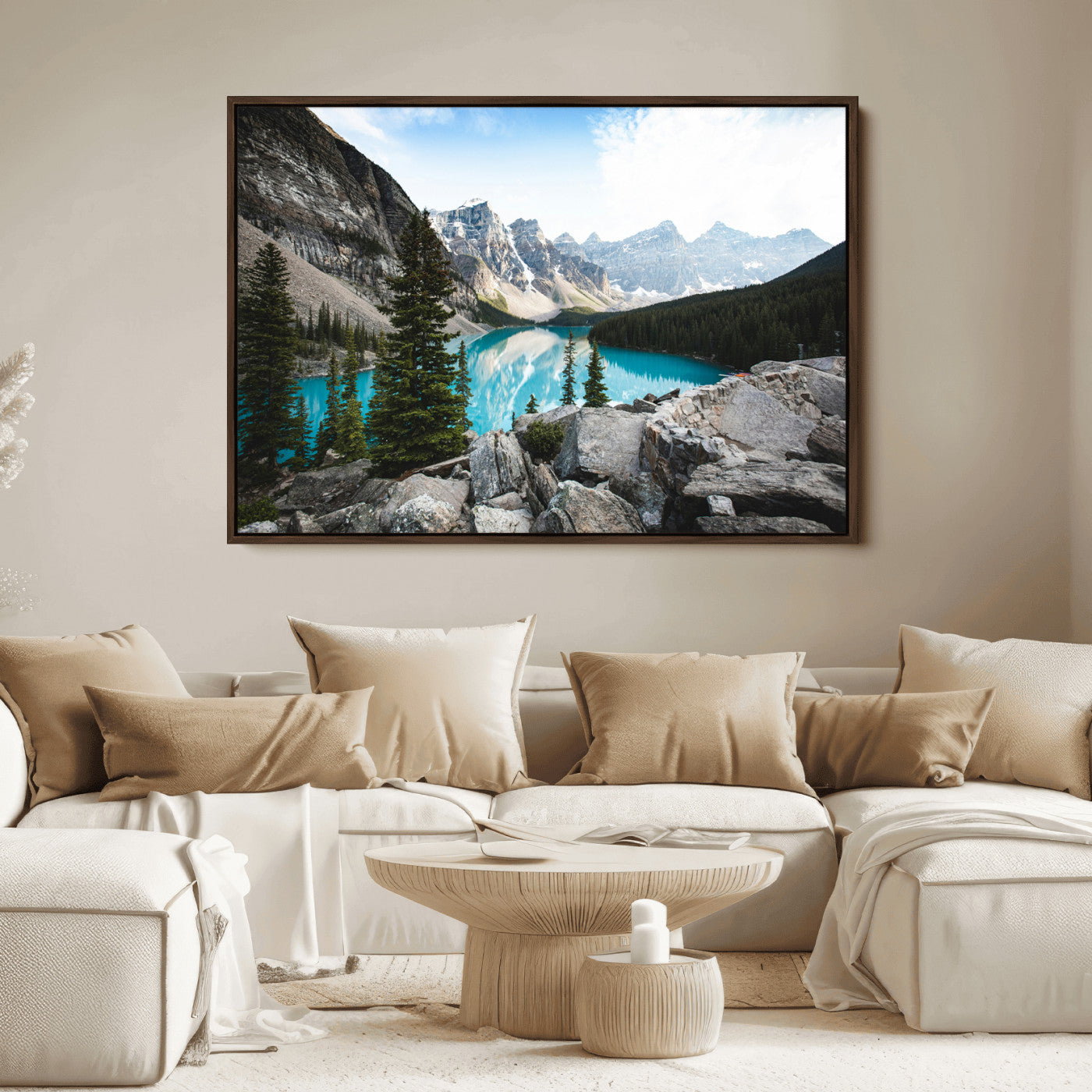Stunning view of Moraine Lake with turquoise waters reflecting snow-capped mountains and evergreen trees, creating a peaceful alpine decor.