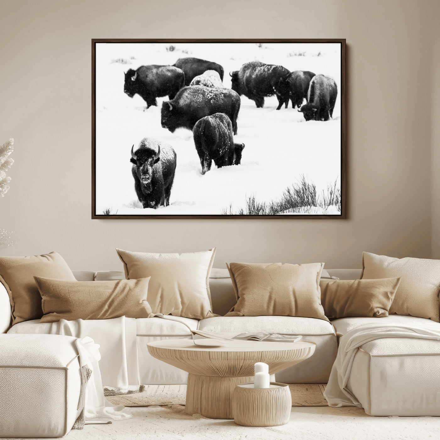 Black and white photograph of a bison herd in a snowy landscape, with snow-covered fur and a rugged wilderness setting, perfect for rustic lodge decor.