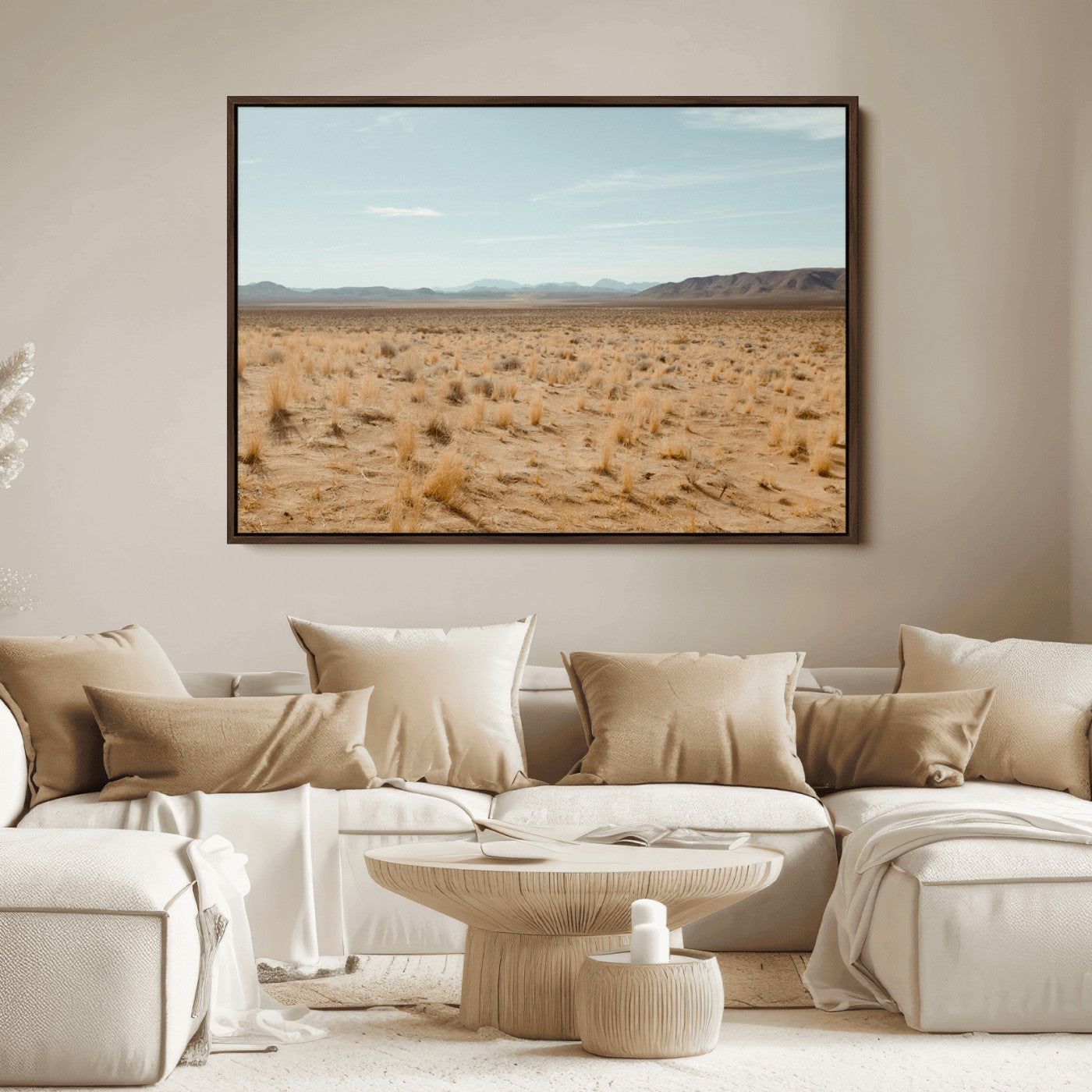 Expansive desert landscape with scattered dry grass and distant mountain range under a pale blue sky – Wall Art Canvas Print.