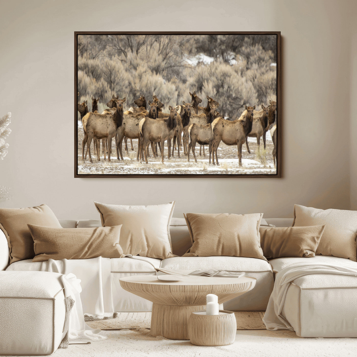 A stunning wall art canvas print featuring a large herd of elk standing together in a natural winter landscape with muted earthy tones and soft background foliage, perfect for rustic or nature-inspired home decor.
