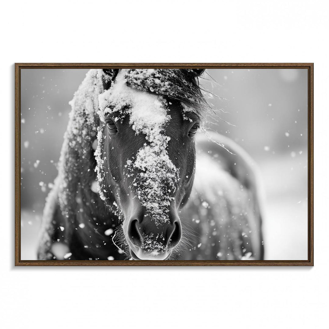 The Black and White Horse Winter Wall Art features a majestic horse with snow-covered hair set against a serene winter backdrop.