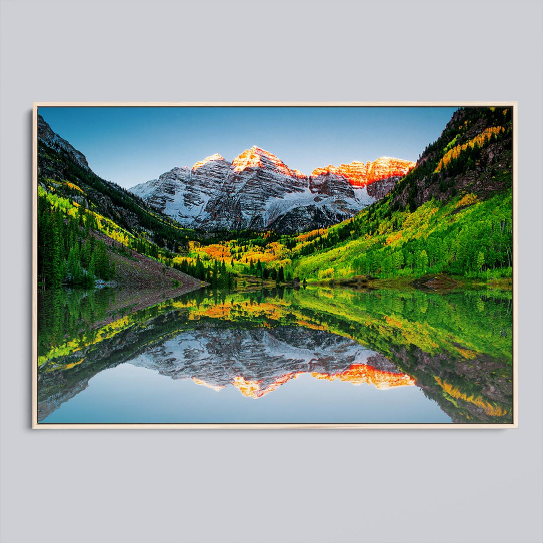 The Sunrise Maroon Bells Lake Wall Art Print beautifully captures North Maroon Peak mirrored in the tranquil lake, framed by lush greenery.