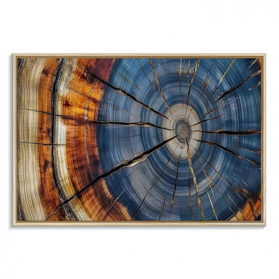 Close-up of blue, brown, and orange wood grain rings on the Abstract Tree Rings Canvas Wall Art Print.