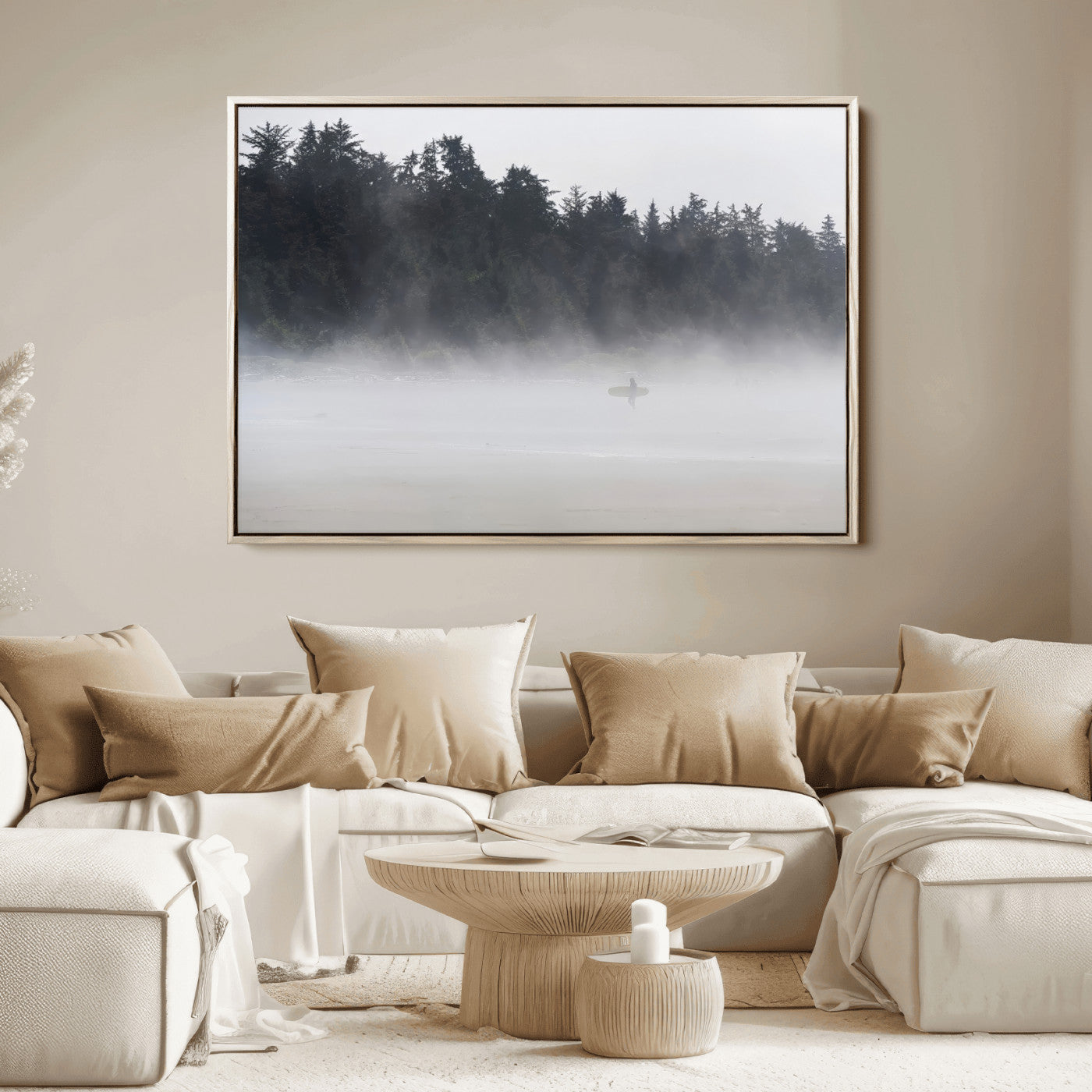 A lone surfer carrying a board through a misty shoreline, surrounded by dense trees and fog, creating a peaceful and mysterious coastal scene.