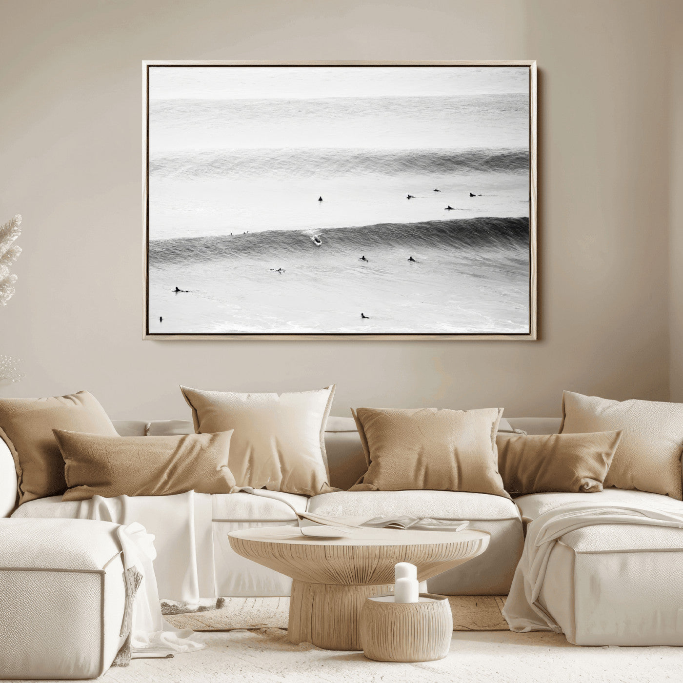 A monochrome photograph of swimmers gliding through gentle ocean waves, evoking a sense of calm and movement.