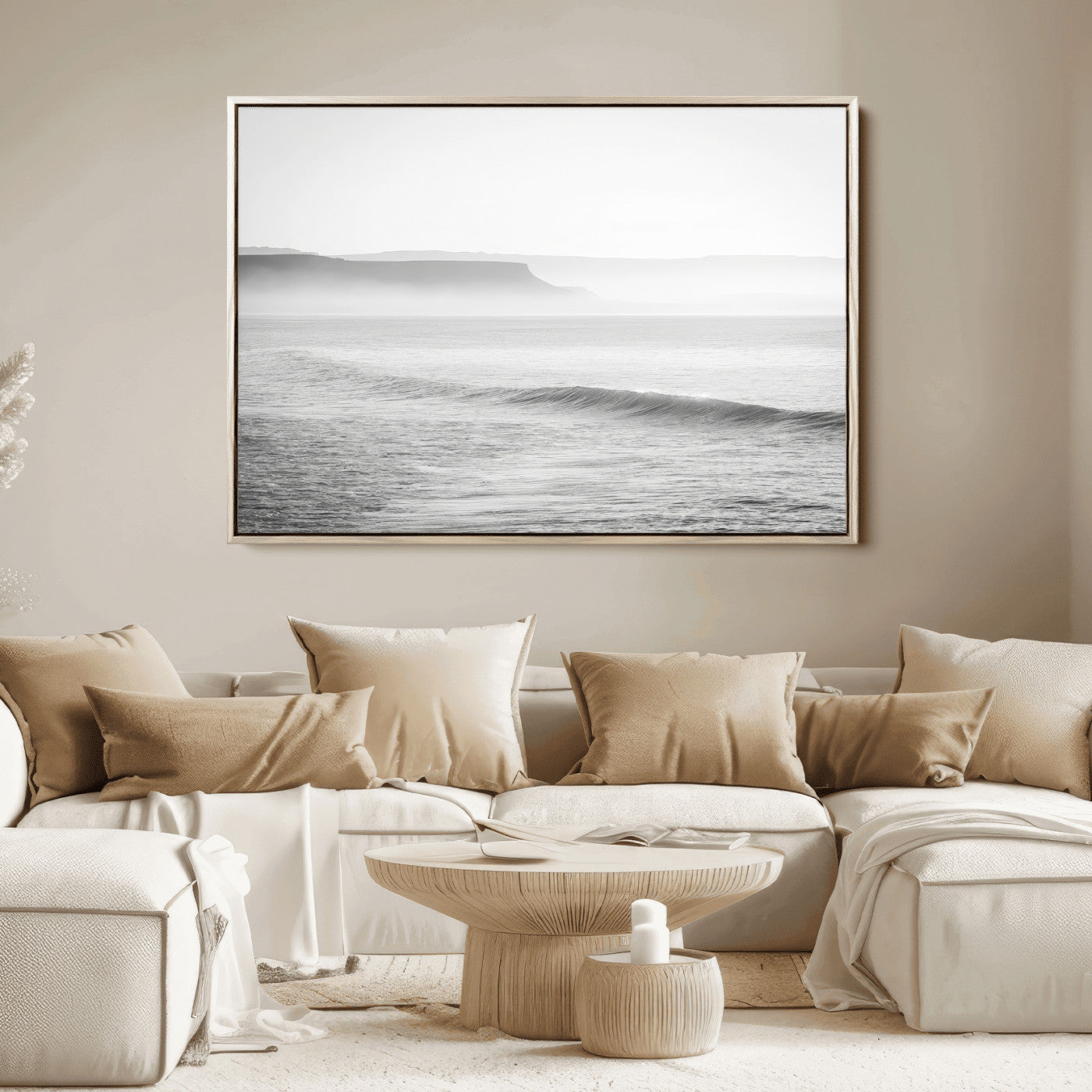 A black and white minimalist seascape featuring soft rolling waves and misty distant cliffs, creating a serene and timeless coastal atmosphere.