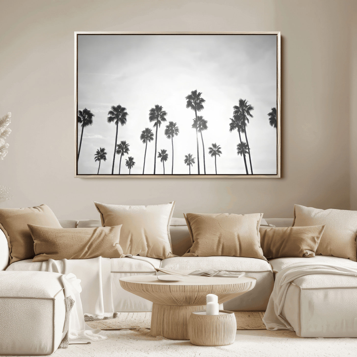 A black and white minimalist scene featuring tall palm trees silhouetted against a bright sky, creating a dreamy and timeless tropical aesthetic.