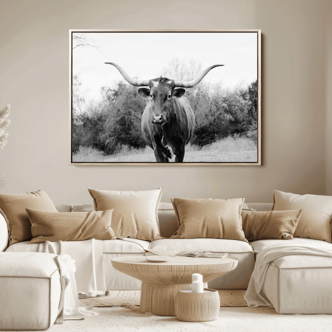 Black and white photo of a Longhorn cow facing camera, ideal for rustic, farmhouse, or western-themed home wall decor.