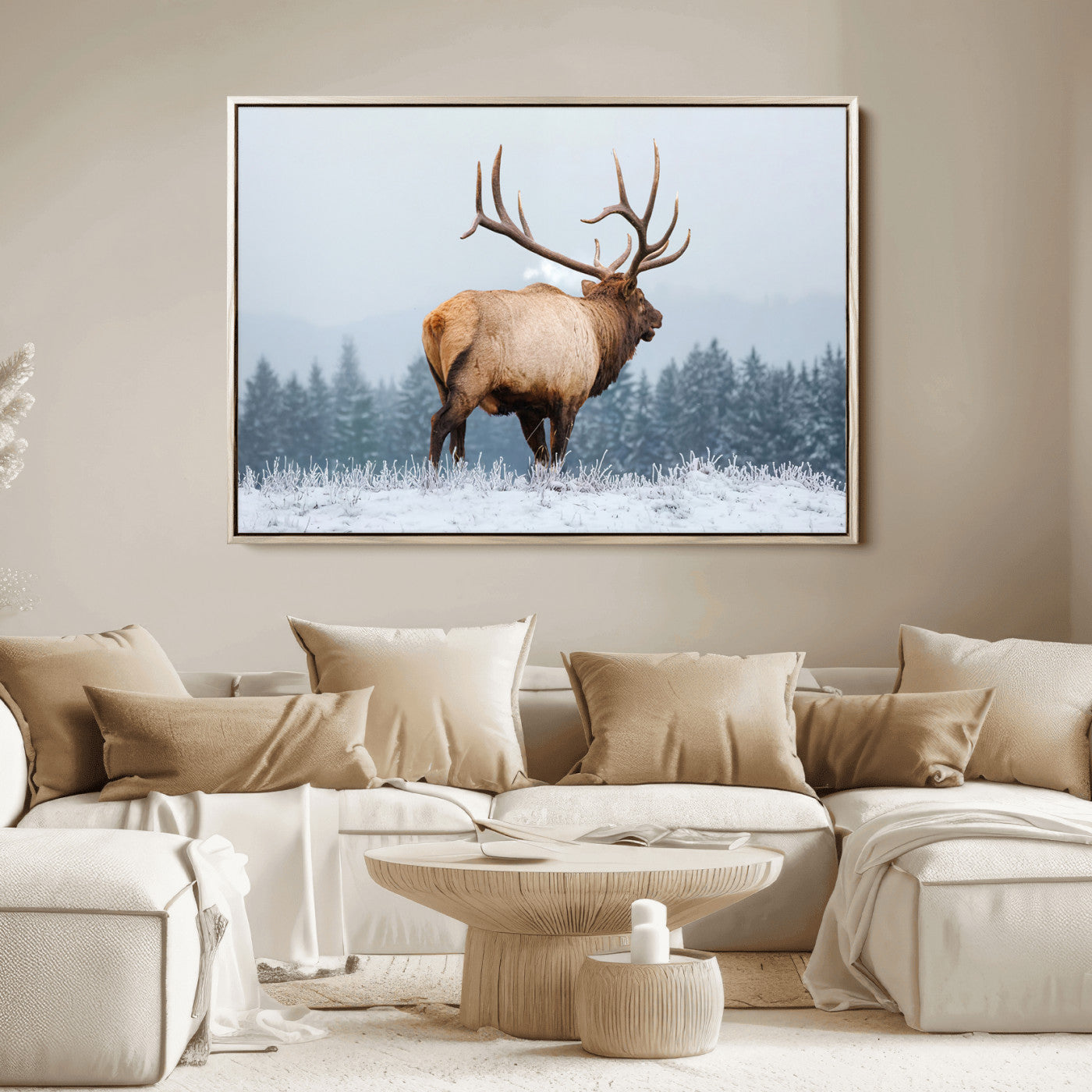 Large elk standing in a snowy field with pine trees in the background, ideal for rustic cabin or lodge-style wall decor.