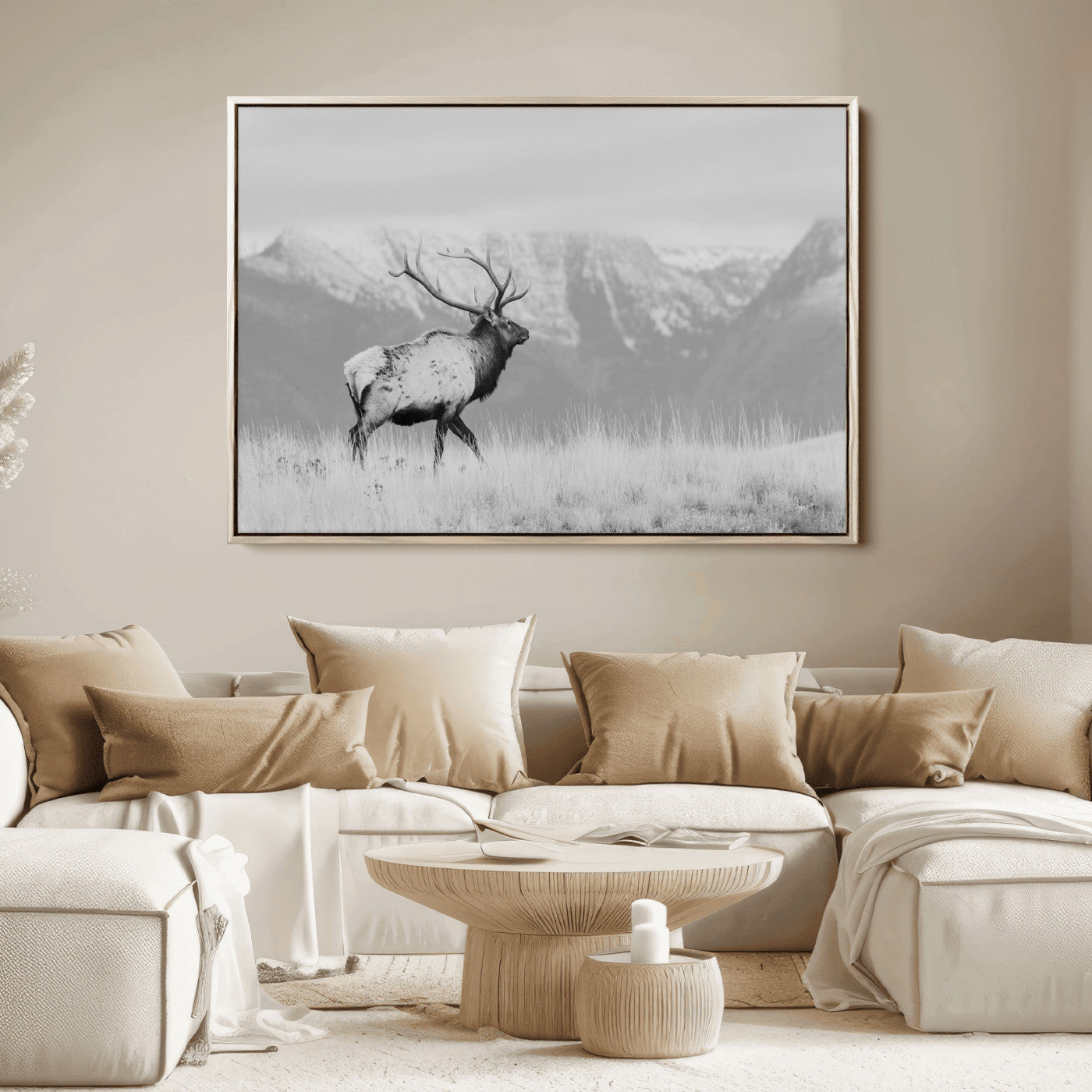 Black and white elk standing in front of snowy mountain range, perfect for rustic lodge or nature-inspired wall decor.