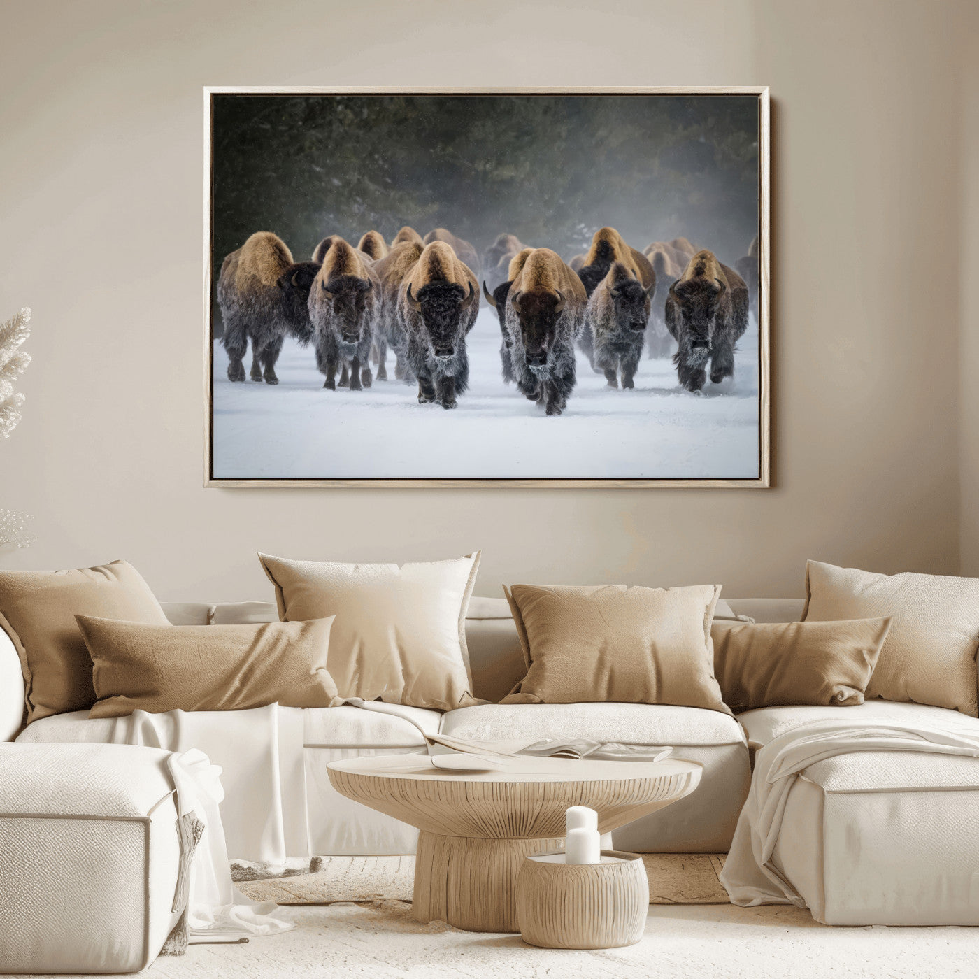 A herd of American bisons walking through deep snow in a forest, evoking a powerful rustic wilderness mood for western-style interiors.