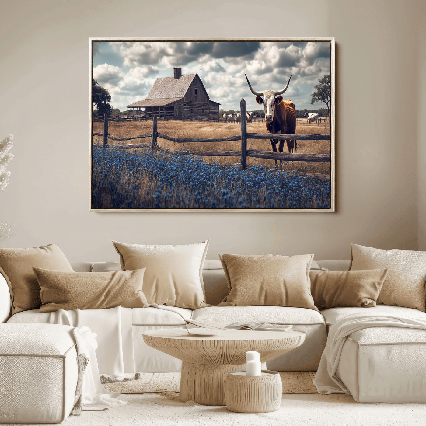 Framed canvas art of a Texas Longhorn cow near a rustic barn and bluebonnet field, ideal for country-style or farmhouse wall decor.