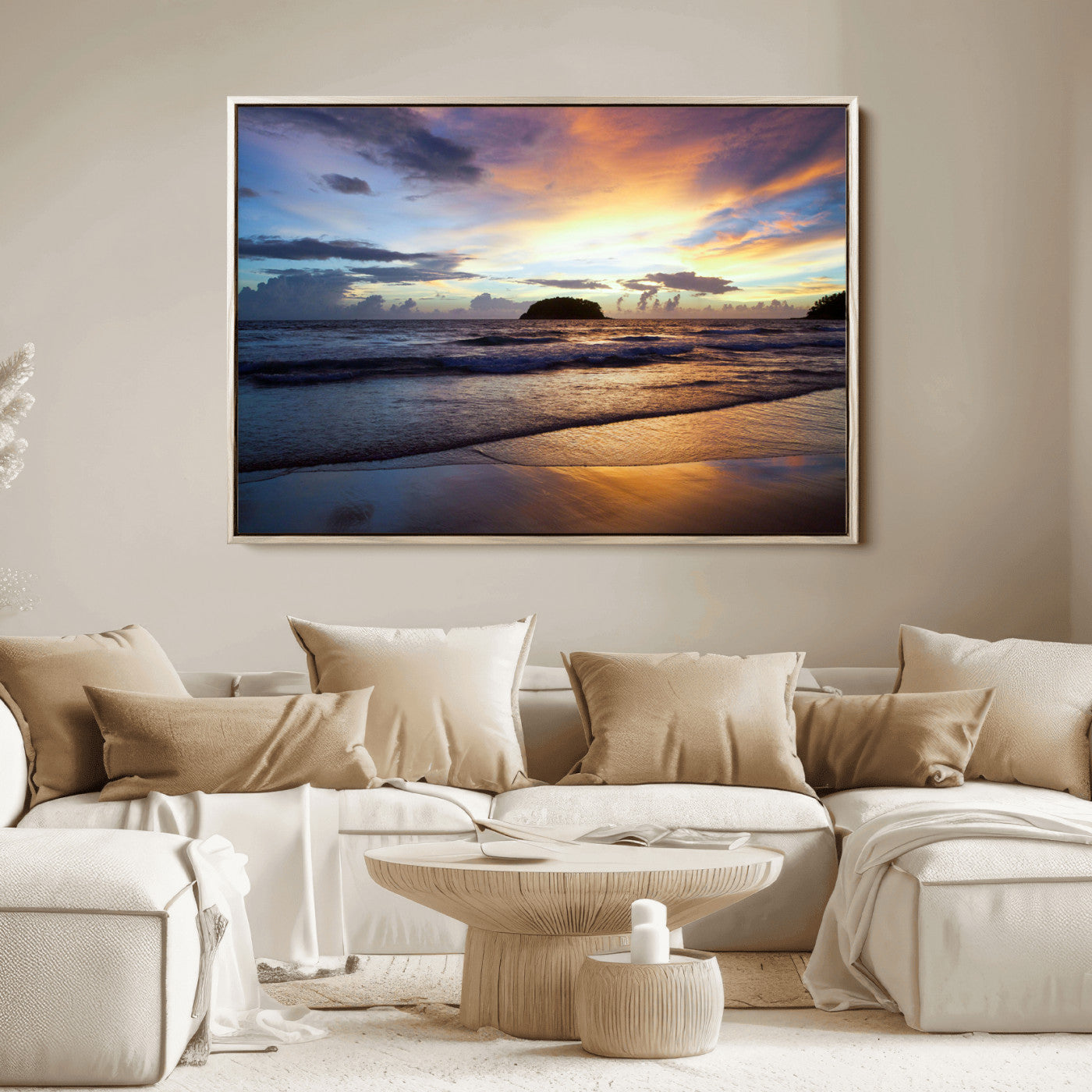A tropical beach at sunset with waves gently washing ashore, reflecting golden and purple hues in the sky, creating a tranquil coastal scene.