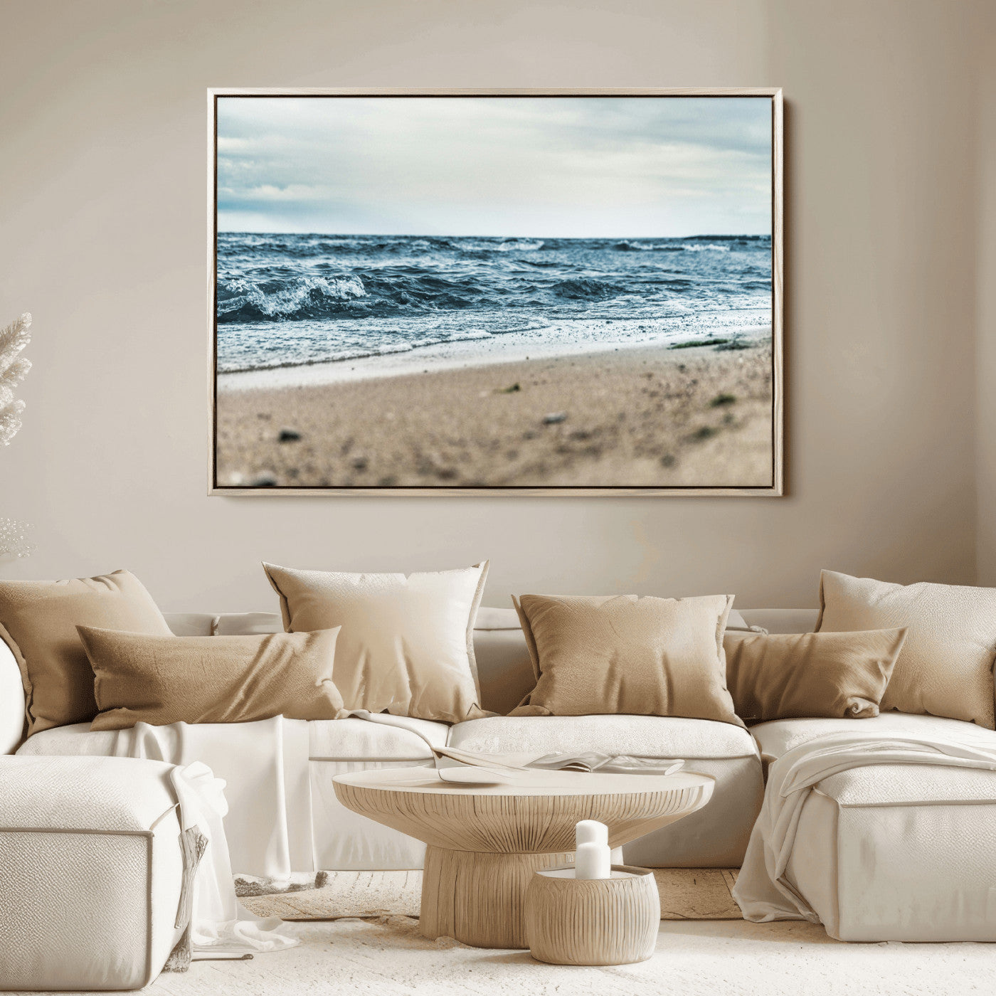 A moody ocean scene with gentle waves washing onto a sandy beach under a cloudy sky, creating a peaceful and coastal atmosphere.