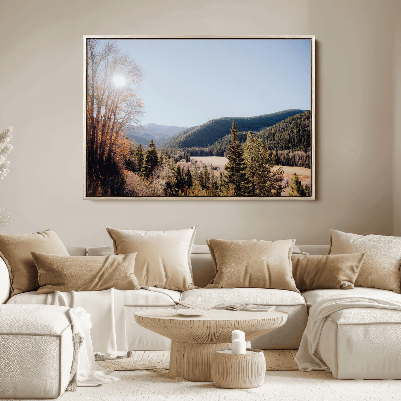 A scenic mountain valley with pine trees and autumn foliage under a clear sky, bathed in golden sunlight, creating a peaceful and rustic landscape.