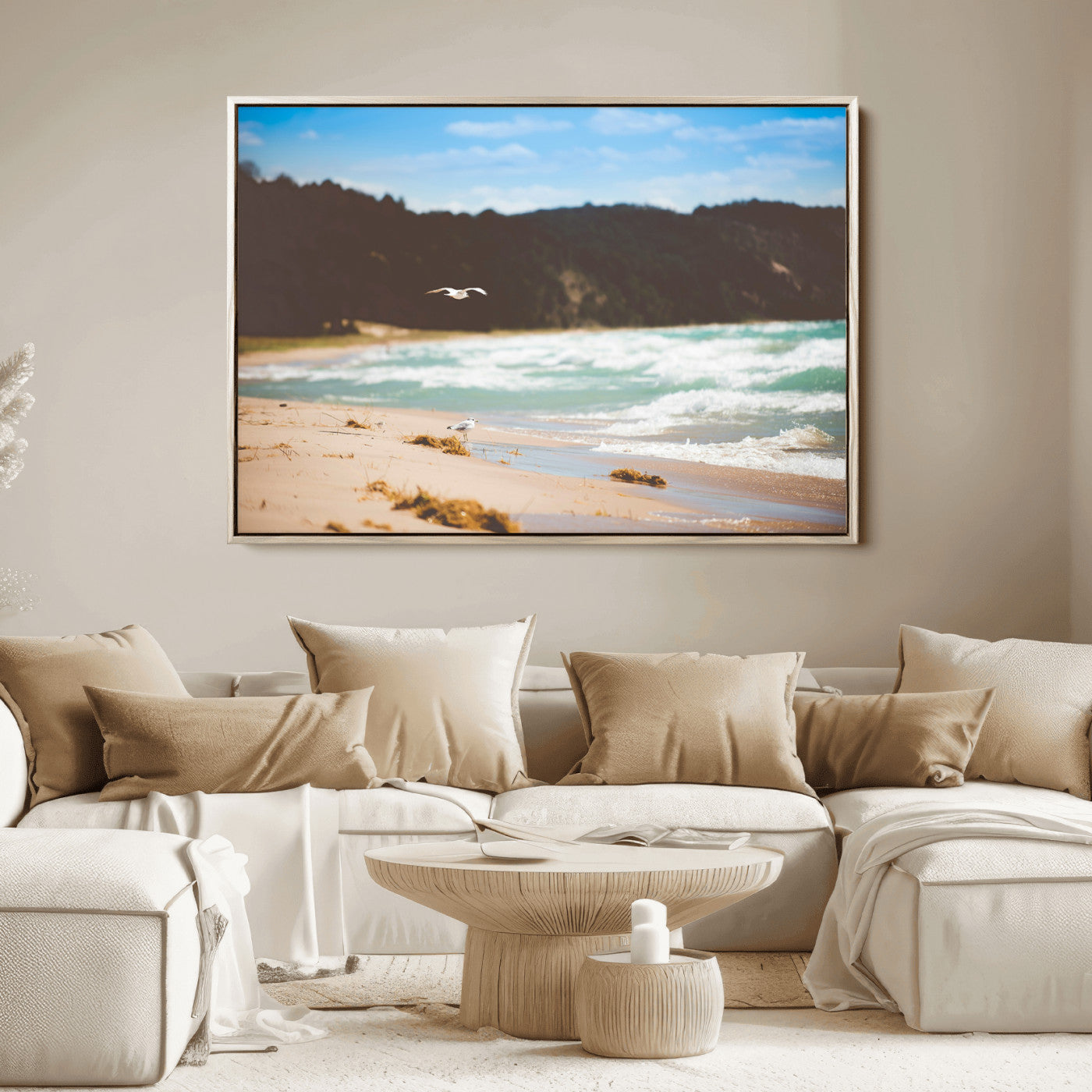 Serene beach scene with gentle ocean waves, sandy shore, and a seagull flying under a blue sky, perfect for coastal and nature-inspired decor.