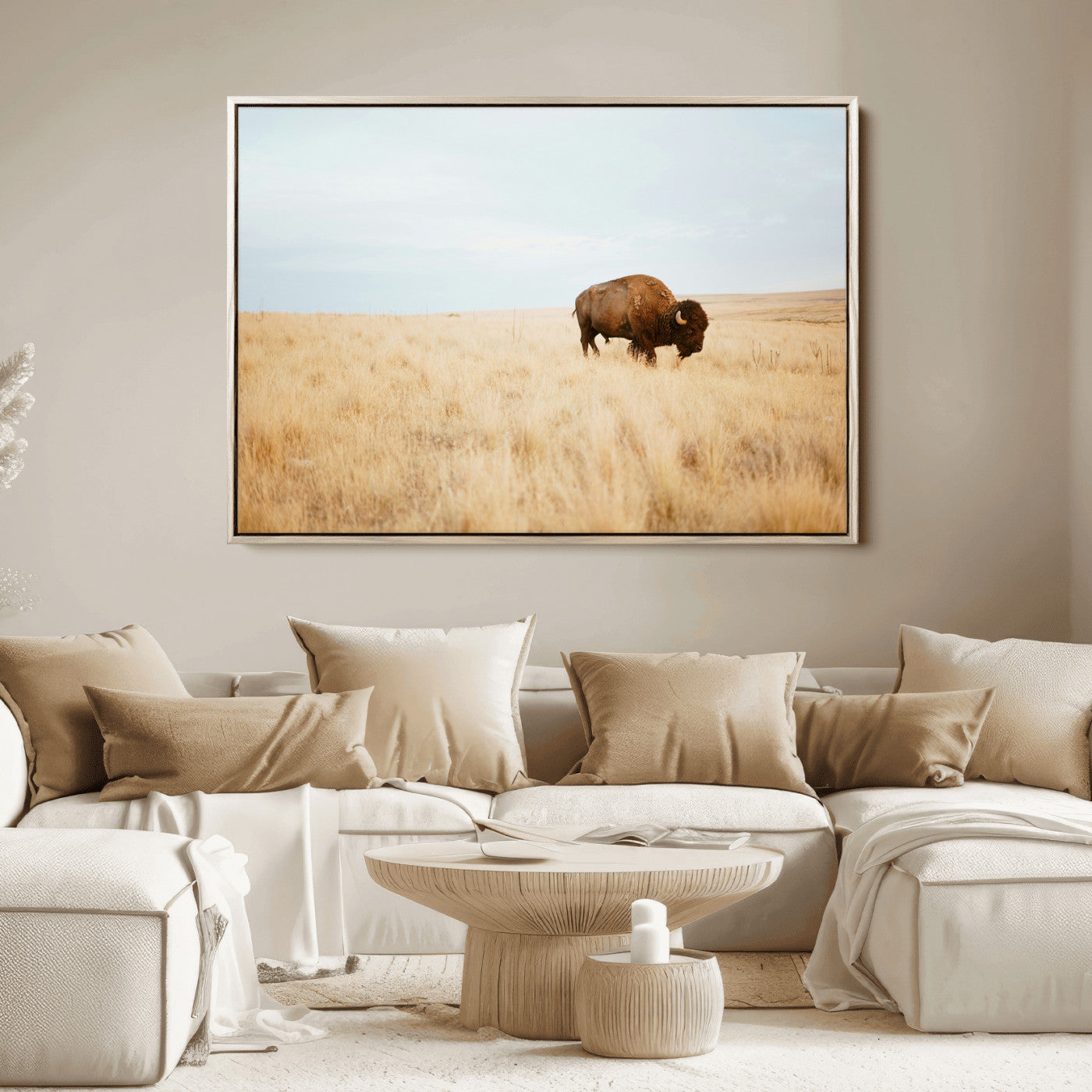 A lone bison standing in a vast golden grassland under a soft blue sky, evoking a rustic and Western aesthetic, ideal for farmhouse decor.