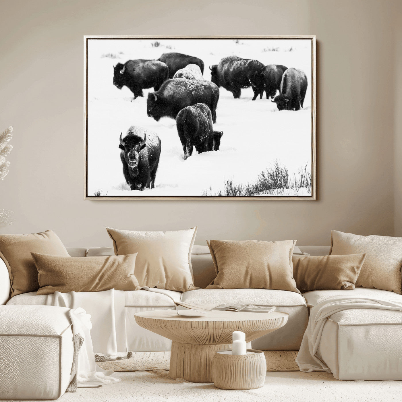 Black and white photograph of a bison herd in a snowy landscape, with snow-covered fur and a rugged wilderness setting, perfect for rustic lodge decor.