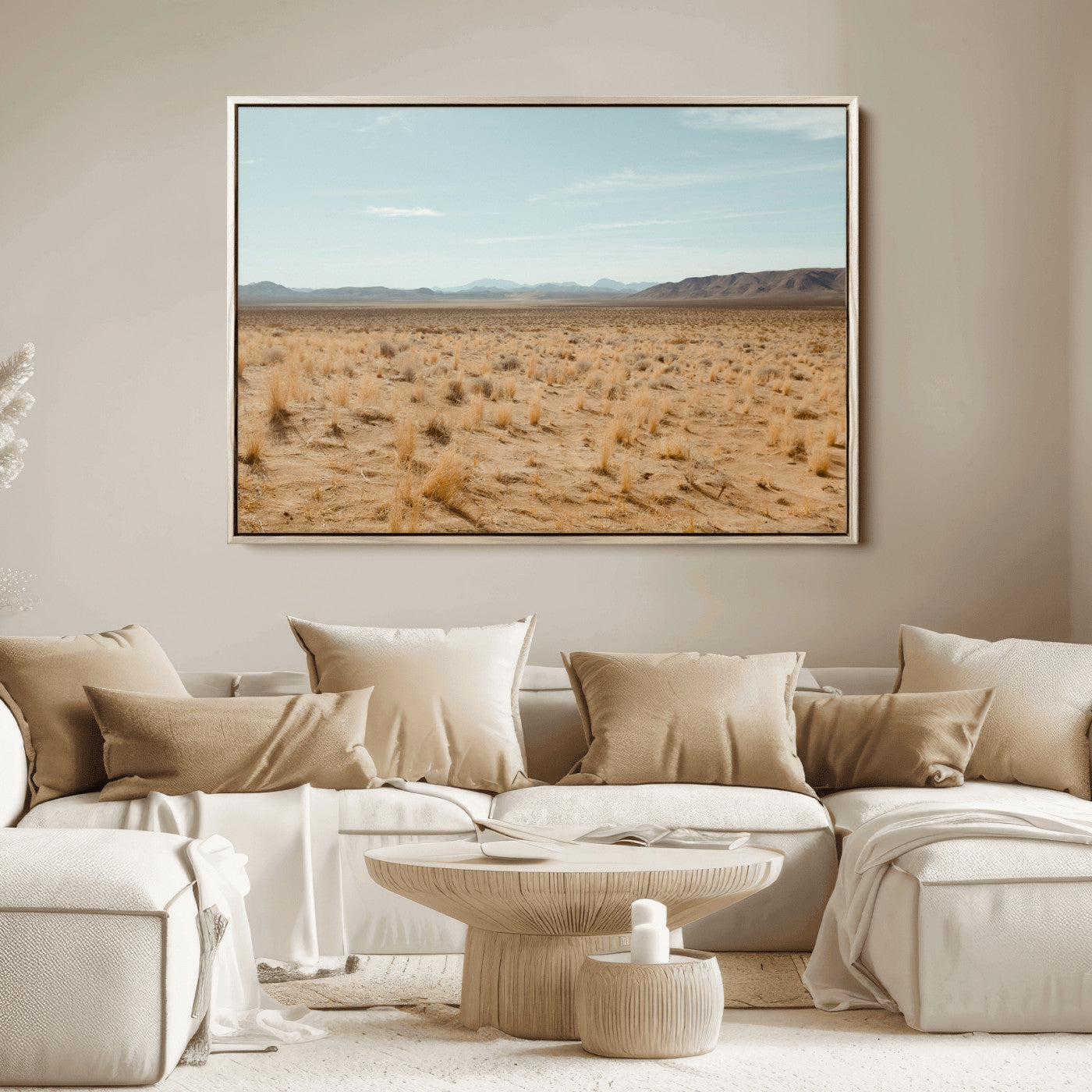 Expansive desert landscape with scattered dry grass and distant mountain range under a pale blue sky – Wall Art Canvas Print.