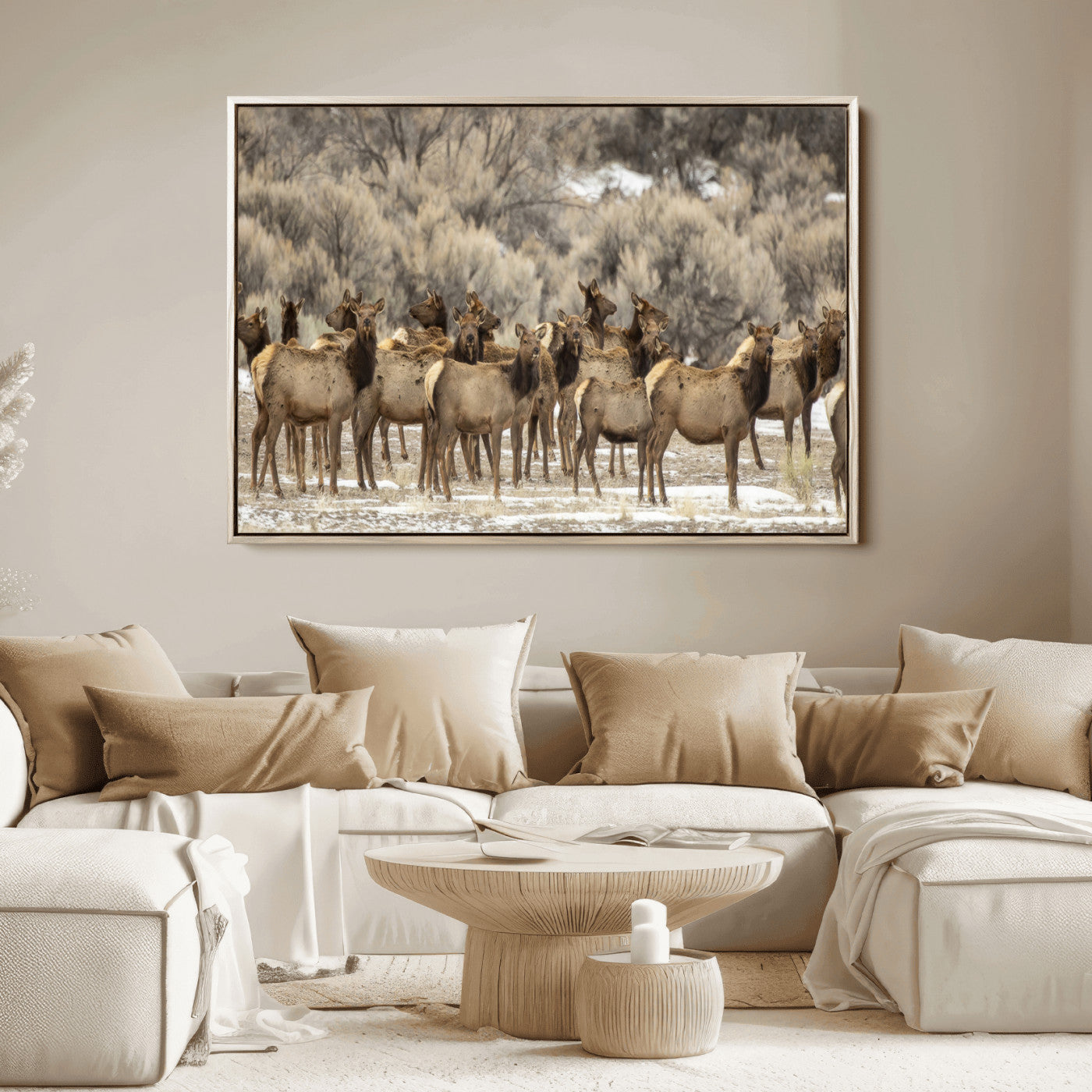 A stunning wall art canvas print featuring a large herd of elk standing together in a natural winter landscape with muted earthy tones and soft background foliage, perfect for rustic or nature-inspired home decor.